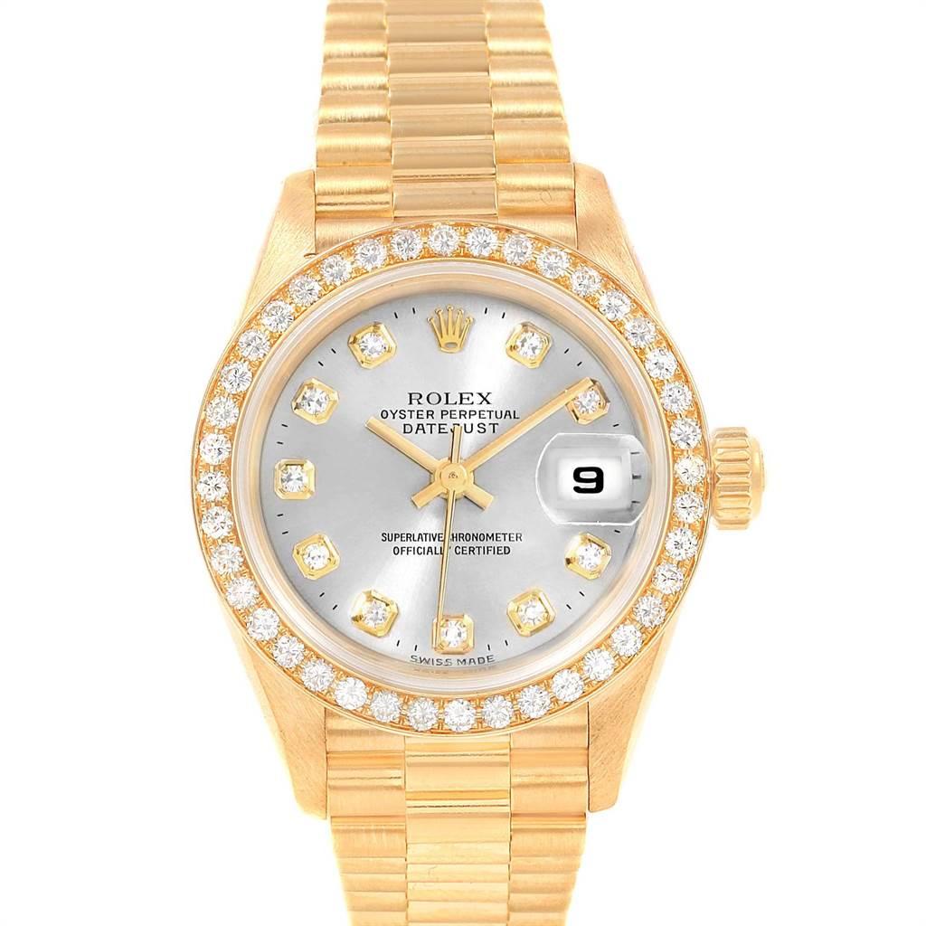 Rolex President 26mm Yellow Gold Diamond Ladies Watch 69138 Box Papers. Officially certified chronometer self-winding movement. 18k yellow gold oyster case 26.0 mm in diameter. Rolex logo on a crown. Original Rolex 18k yellow gold diamond bezel.