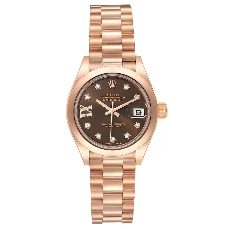 Rolex President 28 Rose Gold Chocolate Dial Ladies Watch 279165 Box Card. Officially certified chronometer self-winding movement. 18k rose gold oyster case 28.0 mm in diameter. Rolex logo on a crown. 18k rose gold smooth domed bezel. Scratch