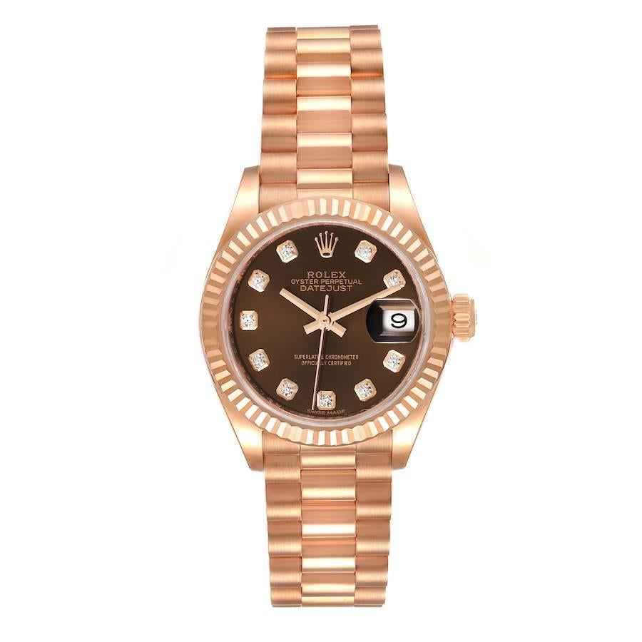 Rolex President 28 Rose Gold Chocolate Diamond Dial Ladies Watch 279175. Officially certified chronometer self-winding movement. 18k rose gold oyster case 28.0 mm in diameter. Rolex logo on a crown. 18k rose gold fluted bezel. Scratch resistant