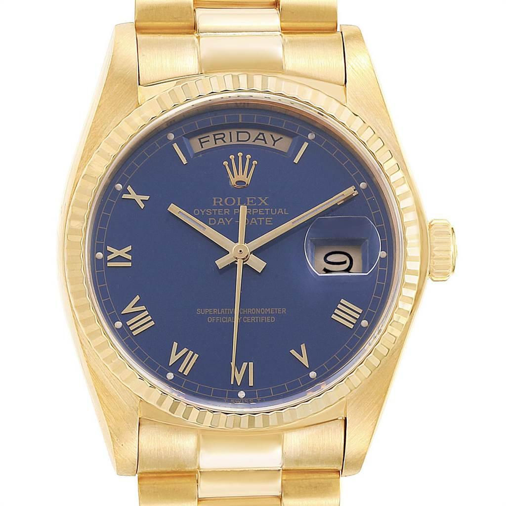 Rolex President 36 Day-Date Yellow Gold Blue Dial Mens Watch 18038. Officially certified chronometer self-winding movement. 18k yellow gold oyster case 36.0 mm in diameter. Rolex logo on a crown. 18k yellow gold fluted bezel. Scratch resistant
