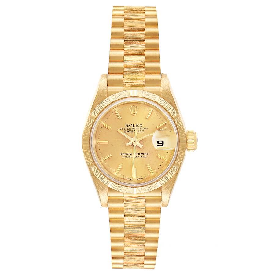 Rolex President Datejust 18K Yellow Gold Bark Finish Ladies Watch 69278. Officially certified chronometer self-winding movement. 18k yellow gold oyster case 26.0 mm in diameter. Rolex logo on a crown. 18k yellow gold engine turned bezel. Scratch