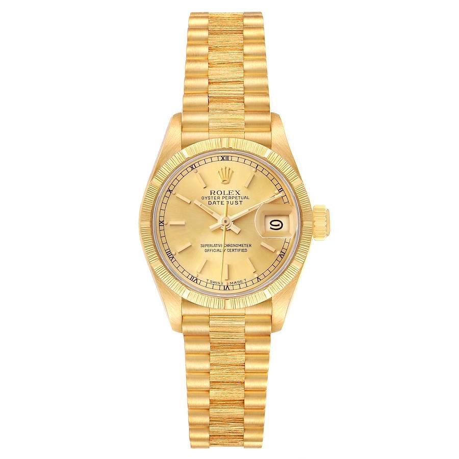 Rolex President Datejust 18K Yellow Gold Bark Finish Watch 69278. Officially certified chronometer self-winding movement. 18k yellow gold oyster case 26.0 mm in diameter. Rolex logo on the crown. 18k yellow gold engine turned bezel with bark finish.