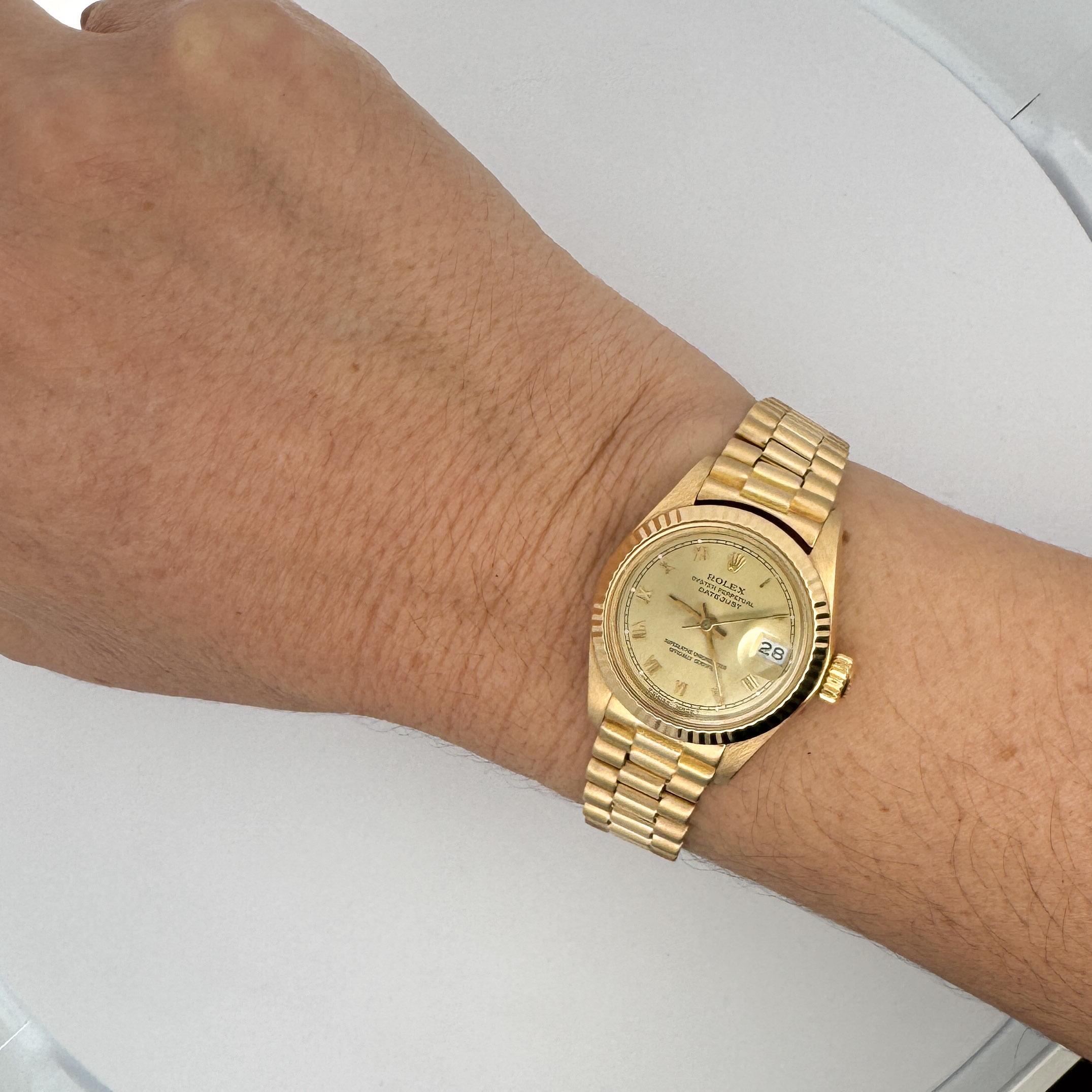 Vintage 1982 Rolex President Datejust 26mm 18k Gold Oyster case with fluted bezel and date bubble. Complete with original Rolex box. 

Details:
Item Type: Rolex Ladies Watch
Metal: 18K Gold
Size: Fits a 6.5-inch wrist
Year of Manufacture: 1982