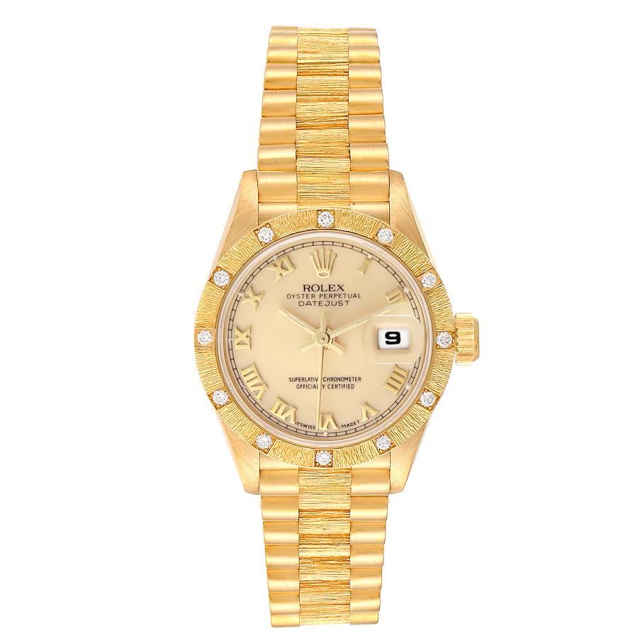 Rolex President Datejust Yellow Gold Bark Finish Ivory Dial Ladies Watch 69288. Officially certified chronometer self-winding movement. 18k yellow gold oyster case 26.0 mm in diameter. Rolex logo on a crown. 18k yellow gold bark finish diamond