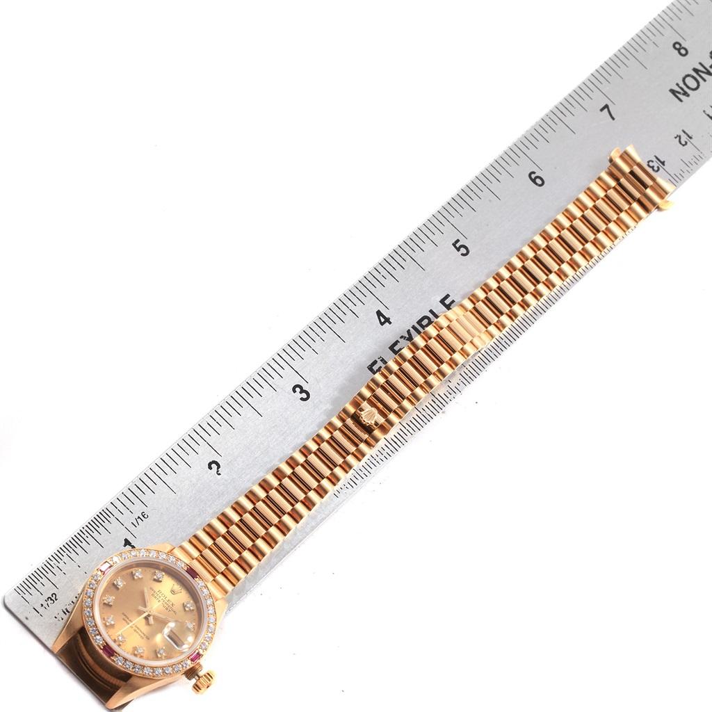 Rolex President Datejust Yellow Gold Diamonds Rubies Ladies Watch 69068. Officially certified chronometer automatic self-winding movement. 18k yellow gold oyster case 26.0 mm in diameter. Rolex logo on a crown. Original Rolex factory 18k yellow gold
