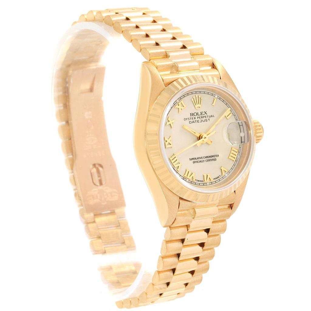 Rolex President Datejust Yellow Gold Ivory Dial Ladies Watch 69178. Officially certified chronometer automatic self-winding movement. 18k yellow gold oyster case 26 mm in diameter. Rolex logo on a crown. 18k yellow gold fluted bezel. Scratch