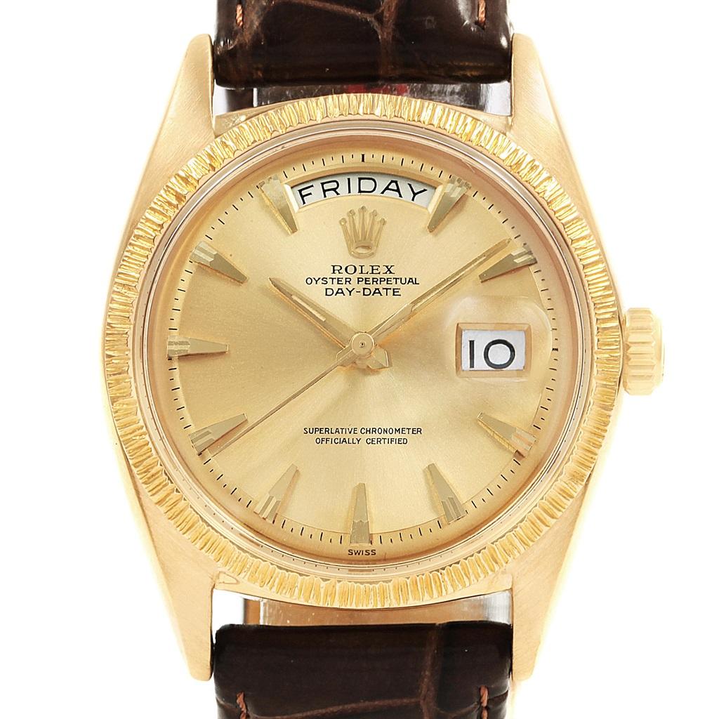 Rolex President Day-Date 18K Yellow Gold Brown Strap Mens Watch 1807. Officially certified chronometer automatic self-winding movement. 18k yellow gold oyster case 36.0 mm in diameter. Rolex logo on a crown. 18k yellow gold bark finish bezel.
