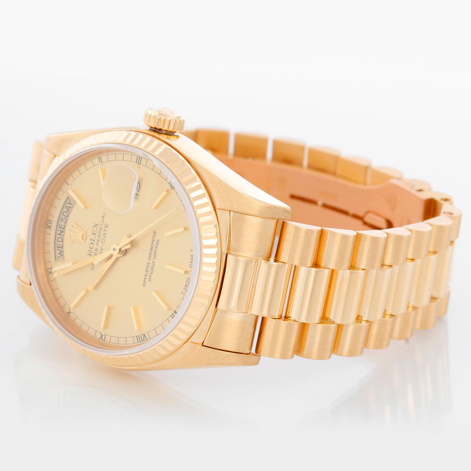 Rolex President Day-Date 18k Yellow Gold Men's Watch 18038 - Automatic winding; quick-set; sapphire crystal. 18k yellow gold case with fluted bezel  (36mm diameter). Champagne dial with stick hour markers . 18k yellow gold President bracelet.
