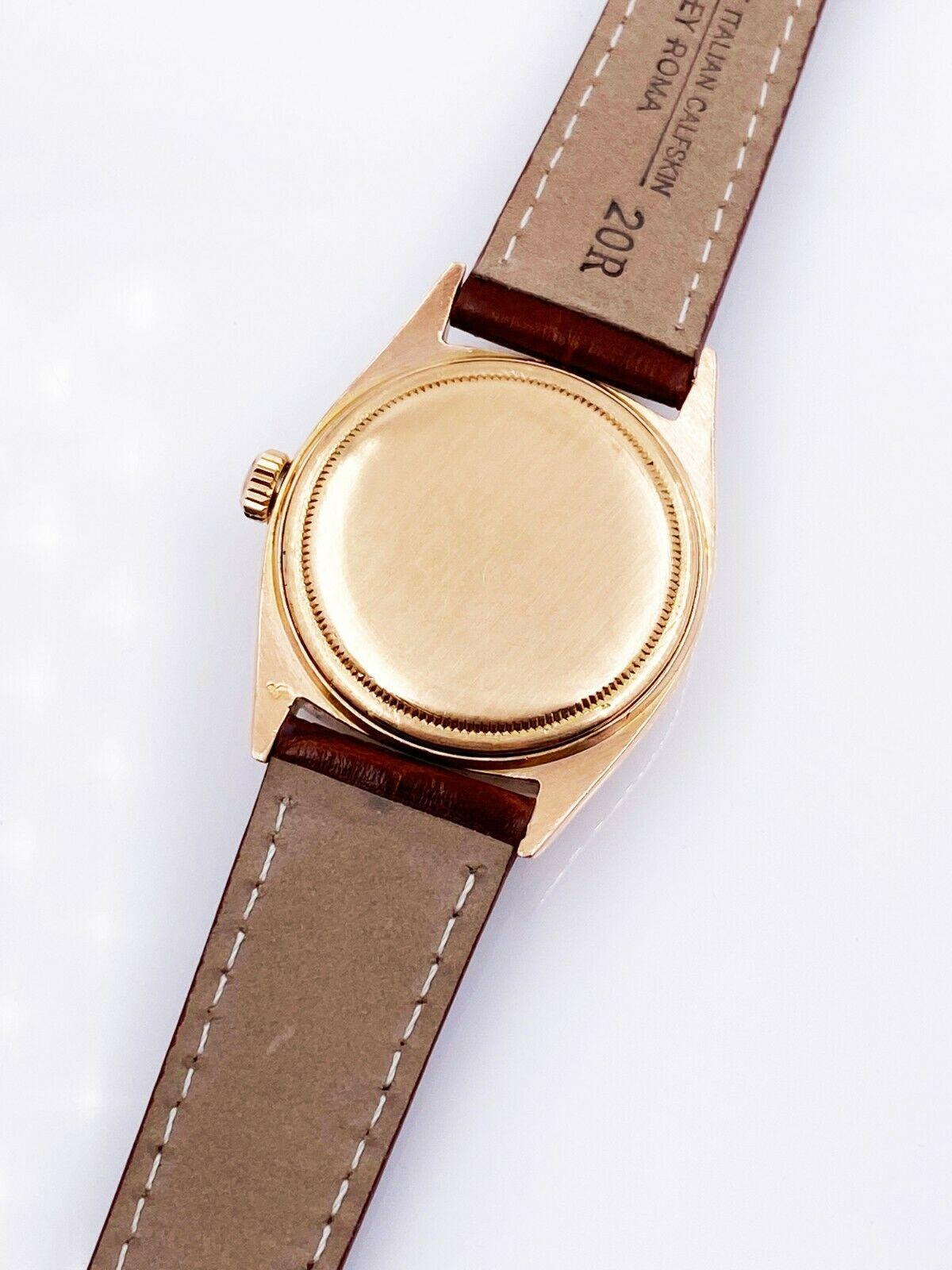 Style Number: 1803

 

Serial: 2154***

 

Model: President Day Date

 

Case Material: 18K Rose Gold 

 

Band: Custom Leather, Brown 

 

Bezel: 18K Rose Gold 

 

Dial: Custom Chocolate Diamond 

 

Face: Acrylic 

 

Case Size: 36mm

