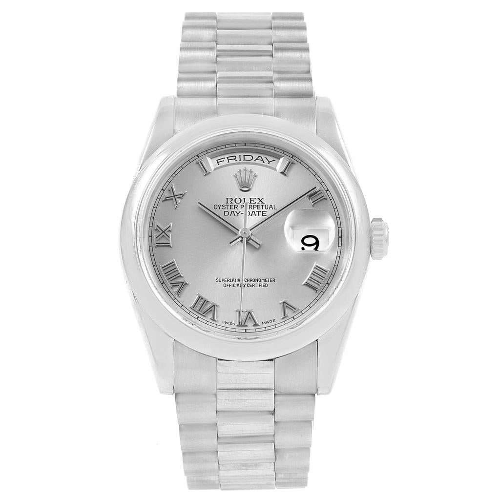 Rolex President Day-Date 18k White Gold Roman Dial Mens Watch 118209. Officially certified chronometer self-winding movement with quickset date function. 18k white gold oyster case 36.0 mm in diameter. Rolex logo on a crown. 18k white gold smooth