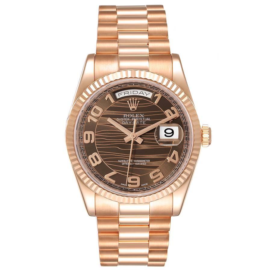 Rolex President Day Date 36 Everose Gold Brown Wave Dial Mens Watch 118235. Officially certified chronometer self-winding movement. Double quick set function. 18k rose gold oyster case 36.0 mm in diameter. Rolex logo on a crown. 18K rose gold fluted