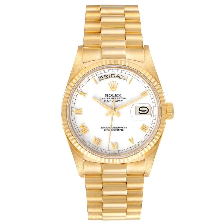 Rolex President Day-Date 36 White Dial Yellow Gold Mens Watch 18038. Officially certified chronometer self-winding movement. 18k yellow gold oyster case 36.0 mm in diameter.  Rolex logo on a crown. 18k yellow gold fluted bezel. Scratch resistant