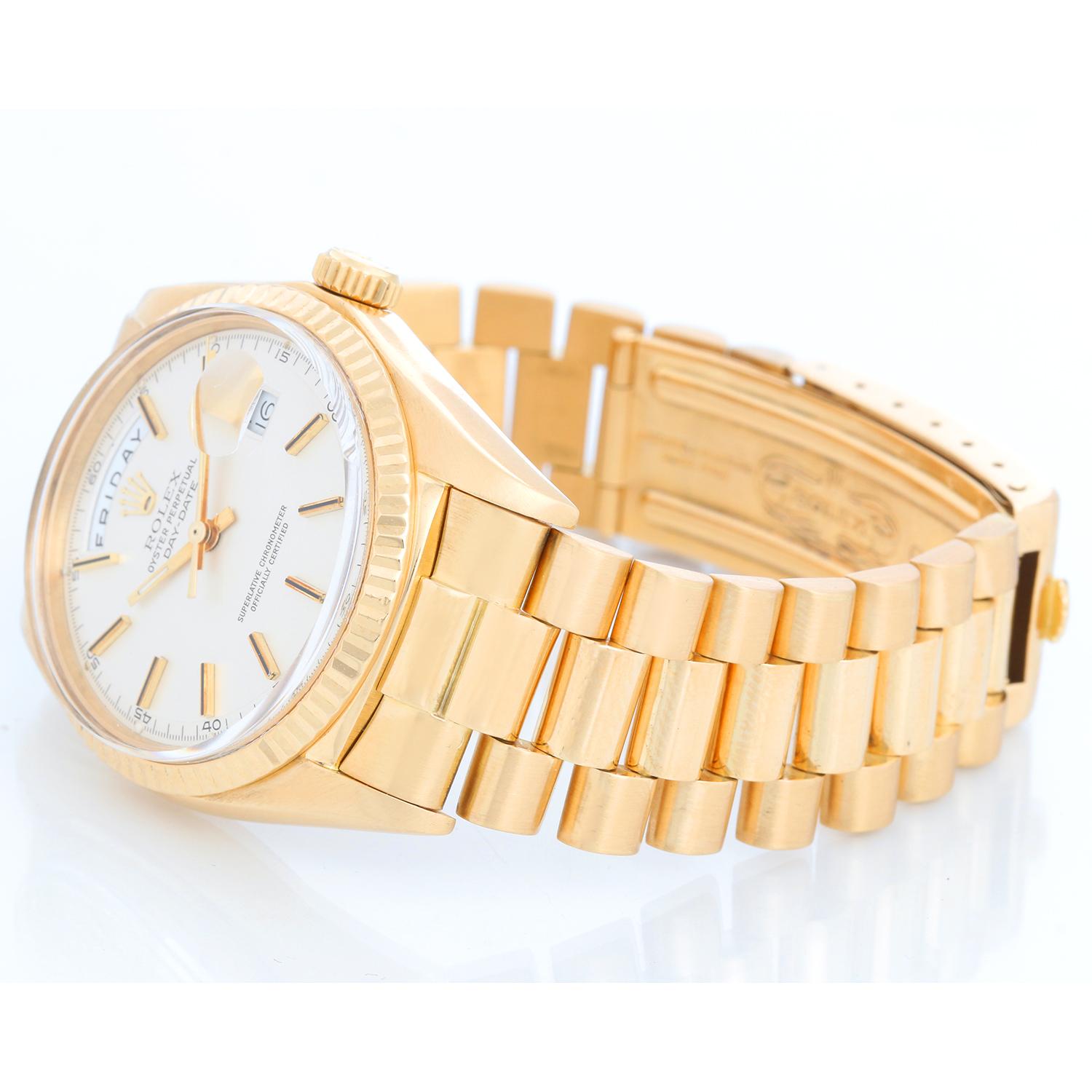 Rolex President Day-Date Men's 18k Gold Watch 1803 - Automatic winding; non-quickset, Acrylic crystal. 18k yellow gold case with fluted bezel (36 mm ). Silver dial with stick hour markers. Rolex President bracelet with gold buckle. Pre-owned with