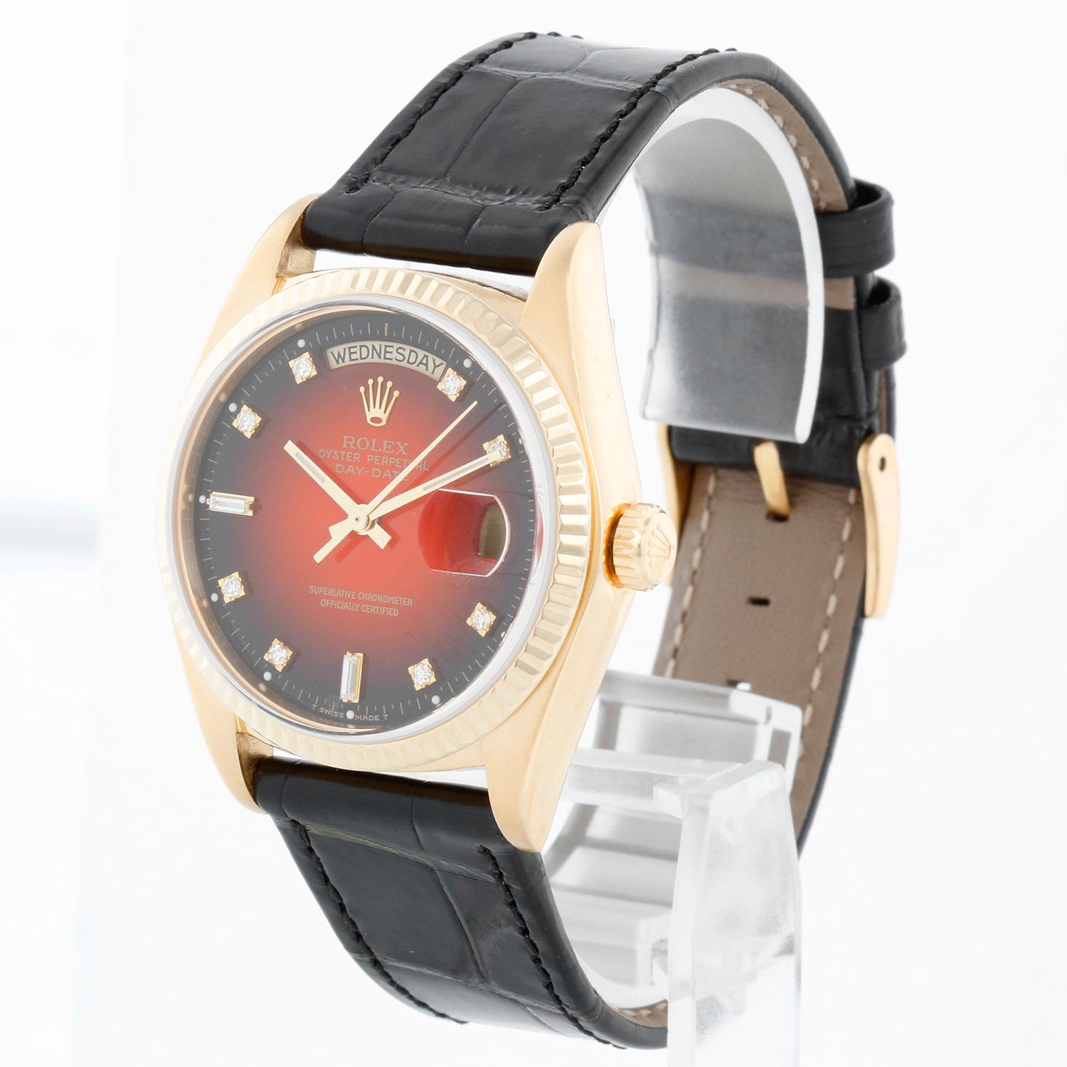 Rolex President Day-Date Men's 18k Gold Watch 18038 - Automatic winding; quick-set; sapphire crystal ( 36 mm) . 18k yellow gold case with fluted bezel . Factory Red Vignette dial . Black Rolex leather band with Rolex buckle . Pre-owned with Rolex
