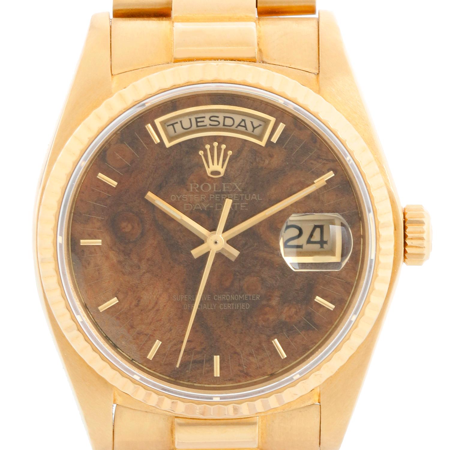 Rolex President Day-Date Men's 18k Gold Watch 18038 - Automatic winding; quick-set; sapphire crystal. 18k yellow gold case with fluted bezel ( 36 mm) . Extremely rare Burlwood dial. 18K Yellow gold President band with hidden clasp. Pre-owned with
