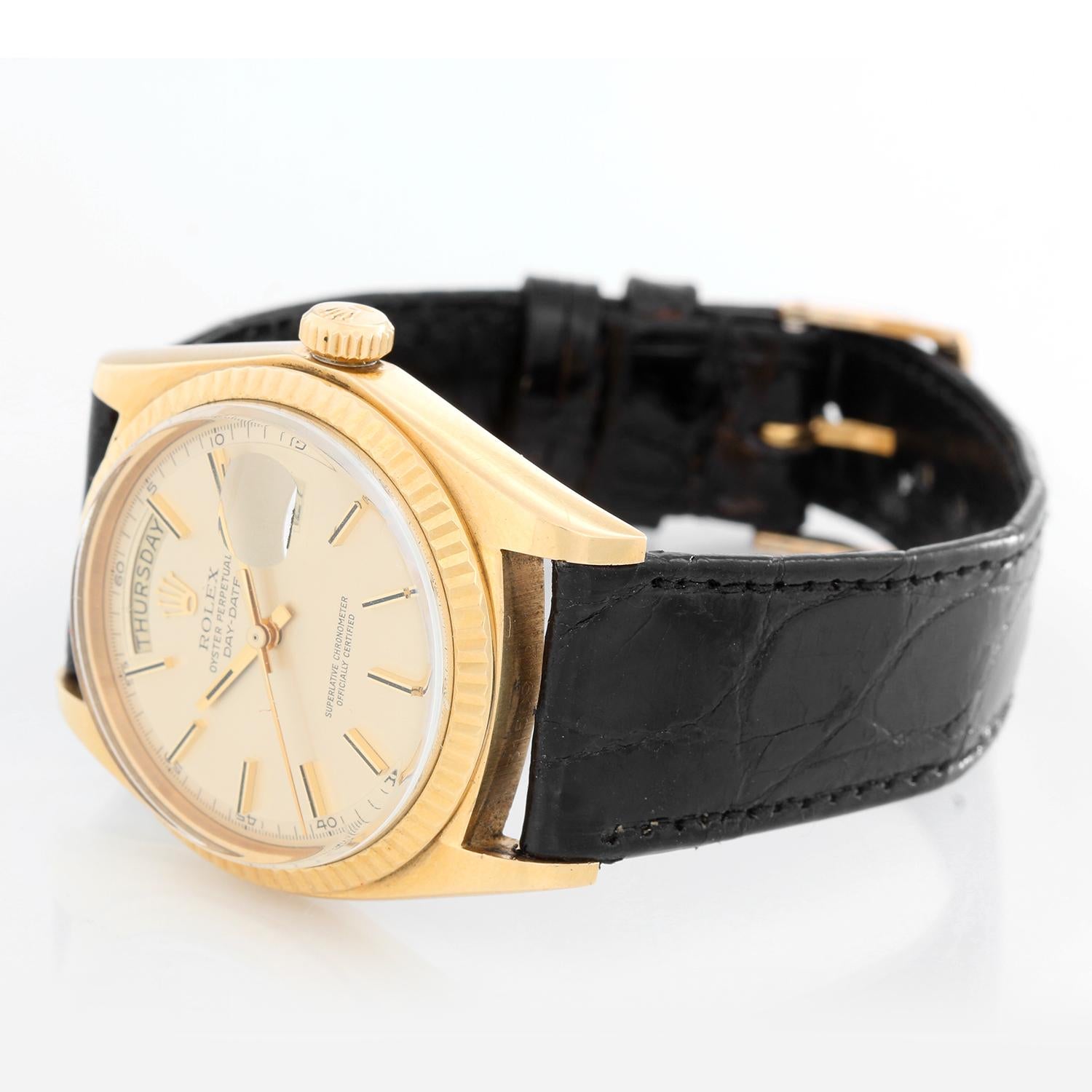 Rolex President Day-Date Men's 18k Yellow Gold Watch 1803 - Automatic winding; 26 jewels, non-quick-set; acrylic crystal. 18k yellow gold case with fluted bezel (36mm diameter). Champagne matte dial with stick hour markers. Black leather strap with
