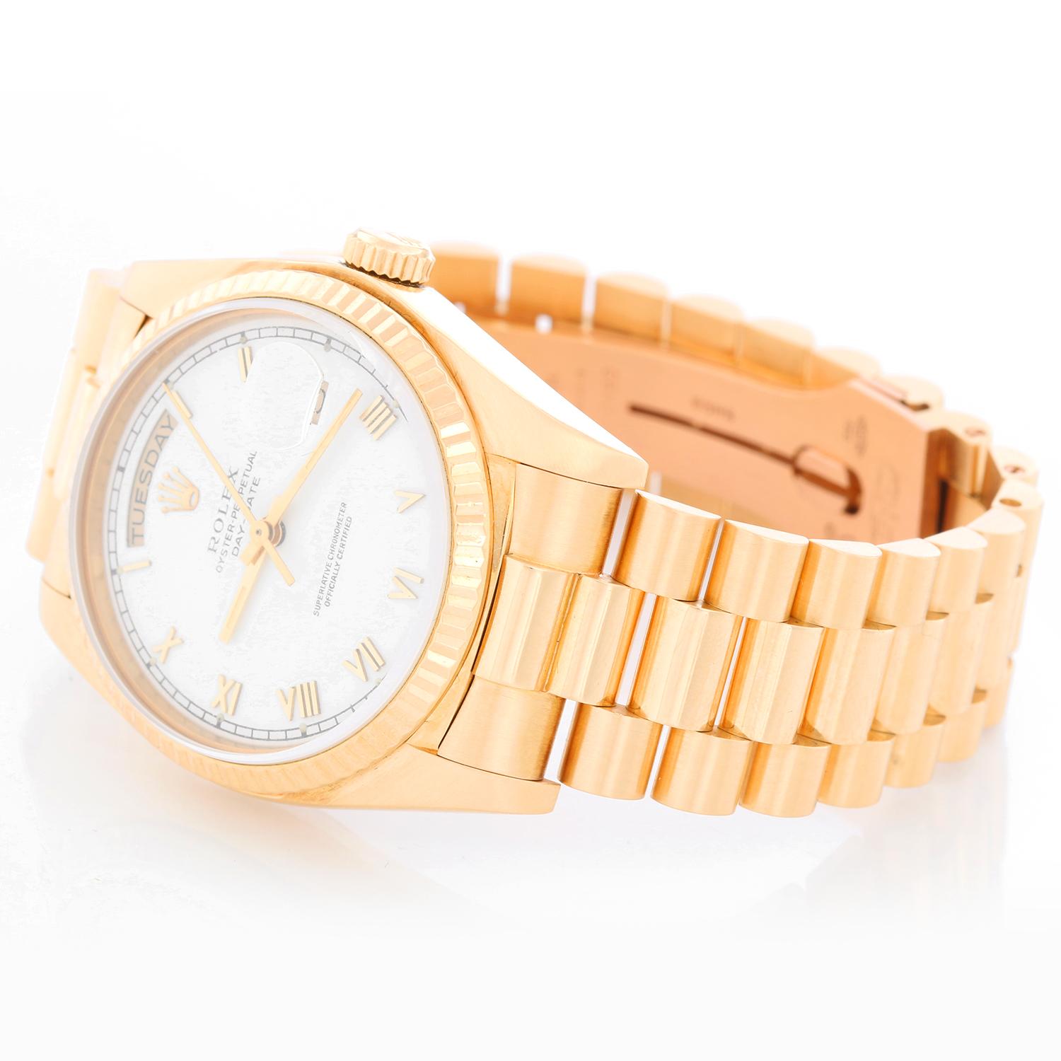Rolex President Day-Date Men's' 18k Yellow Gold Watch 18038 - Automatic winding, 27 jewels, Quickset date, sapphire crystal. 18k yellow gold case with fluted bezel. White dial with skinny Roman numerals. 18k yellow gold President bracelet. Pre-owned