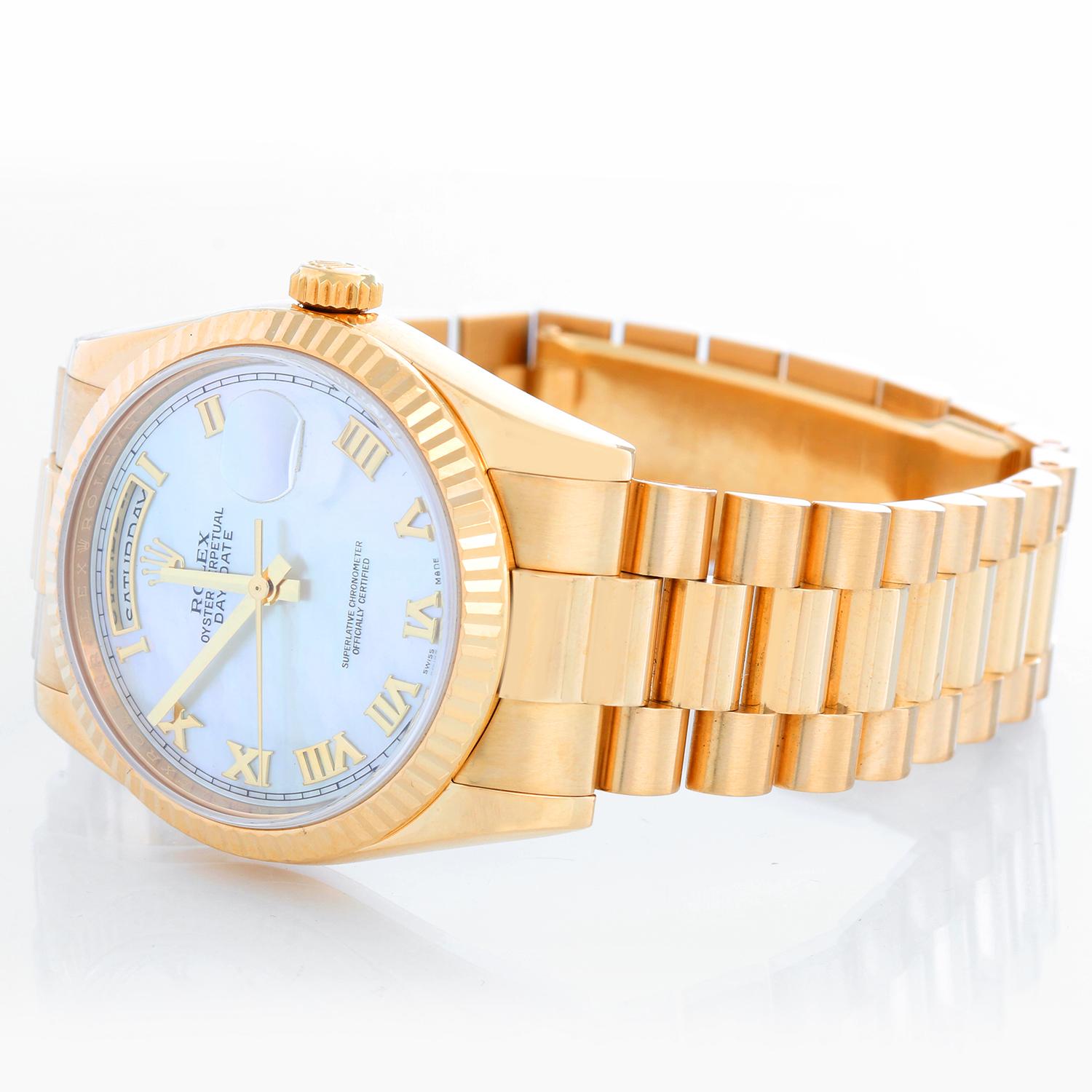 Rolex President Day-Date Men's Watch 118238 - Automatic winding, 31 jewels, Quickset, sapphire crystal. 18k yellow gold case with fluted bezel (36mm diameter). Genuine Rolex Mother of Pearl dial with Roman numerals. 18k yellow gold hidden-clasp