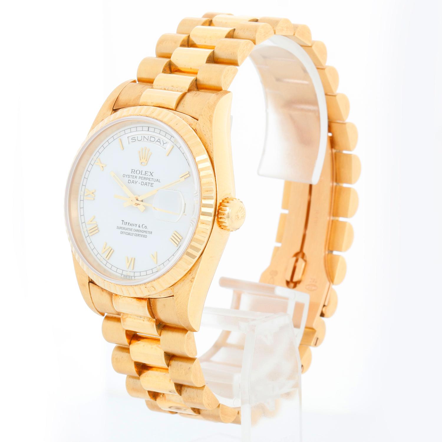 Rolex President Day-Date Men's Watch 18238 - Automatic winding,31 jewels, Quickset, sapphire crystal. 18k yellow gold case with fluted bezel . White Tiffany dial with Roman markers. 18k yellow gold hidden-clasp President bracelet. Like-new with full