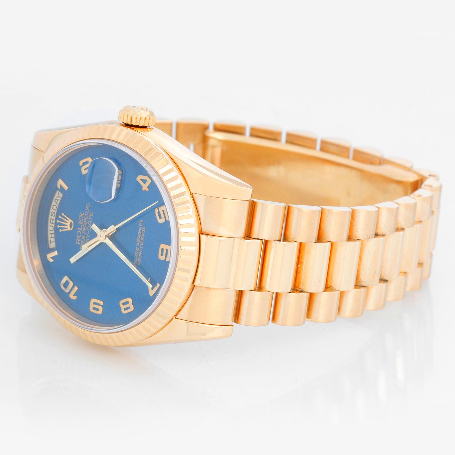 Rolex President Day-Date Men's Watch Blue Jubilee Dial 118238 - Automatic winding, 31 jewels, Quickset, sapphire crystal. 18k yellow gold case with fluted bezel (36mm diameter). Blue jubilee dial with Arabic numerals. 18k yellow gold hidden-clasp