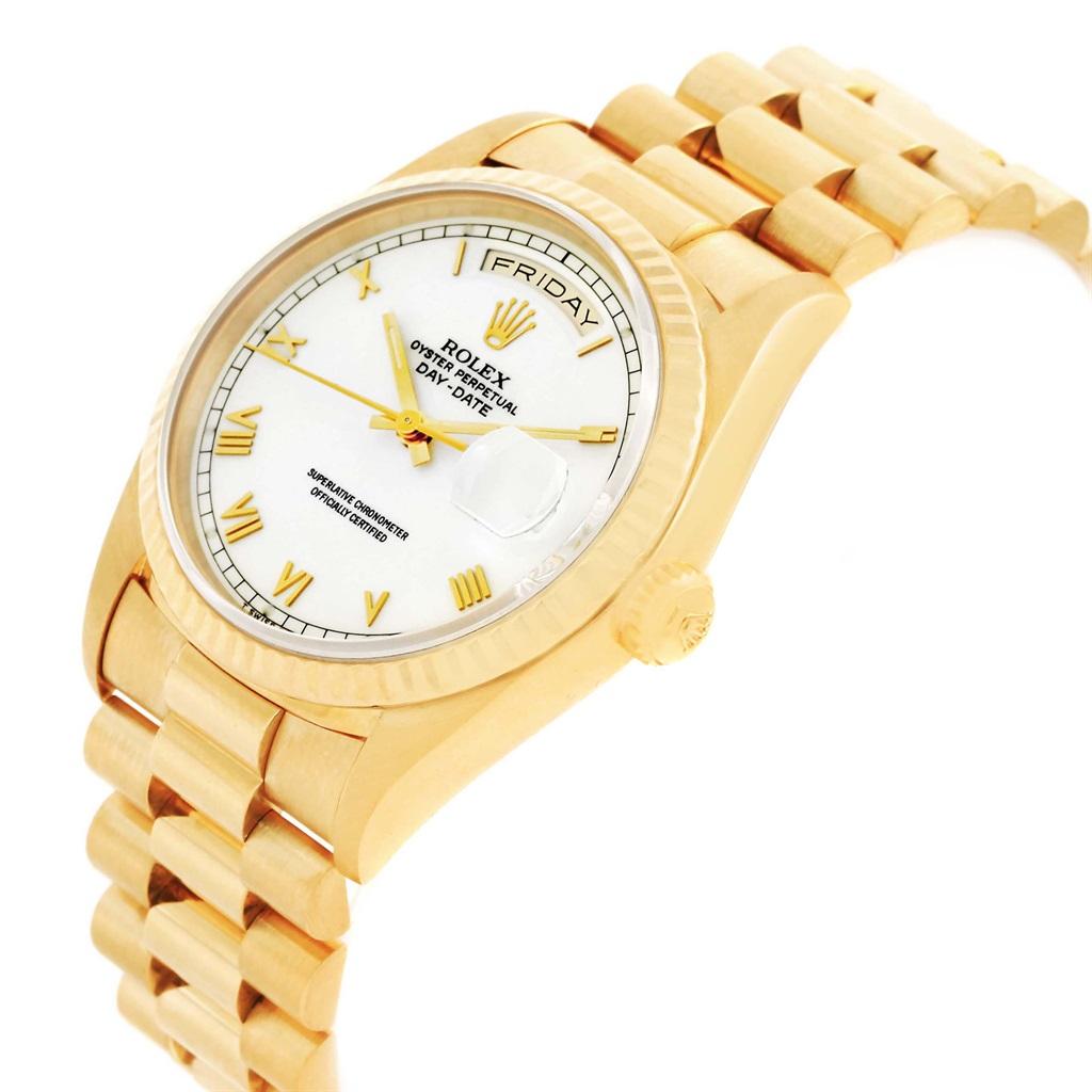 Rolex President Day Date White Dial Yellow Gold Watch 18238 Box Papers. Officially certified chronometer automatic self-winding movement. 18k yellow gold oyster case 36.0 mm in diameter. Rolex logo on a crown. 18k yellow gold fluted bezel. Scratch
