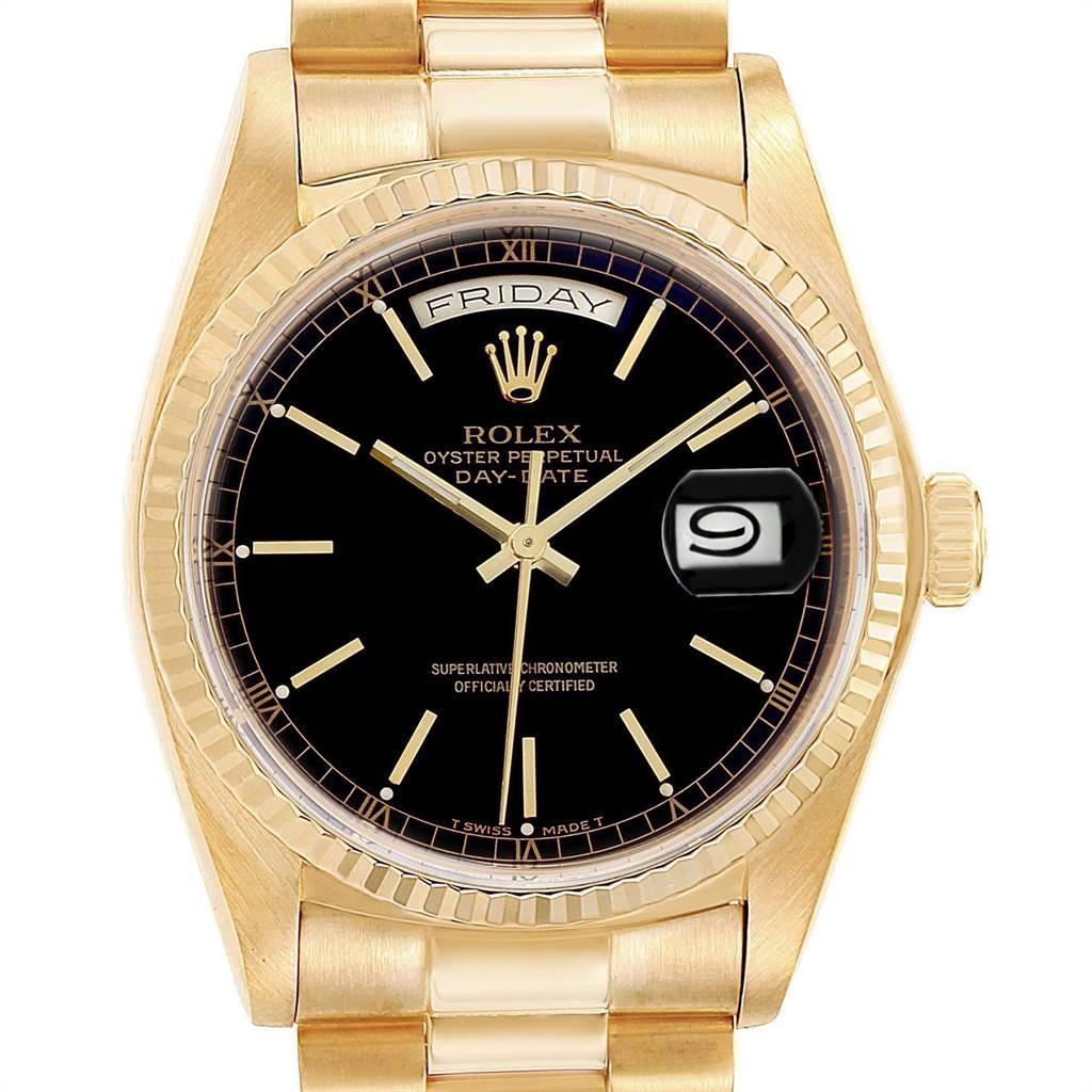 Rolex President Day-Date Yellow Gold Black Dial Mens Watch 18038. Officially certified chronometer self-winding movement. 18k yellow gold oyster case 36.0 mm in diameter. Rolex logo on a crown. 18k yellow gold fluted bezel. Scratch resistant