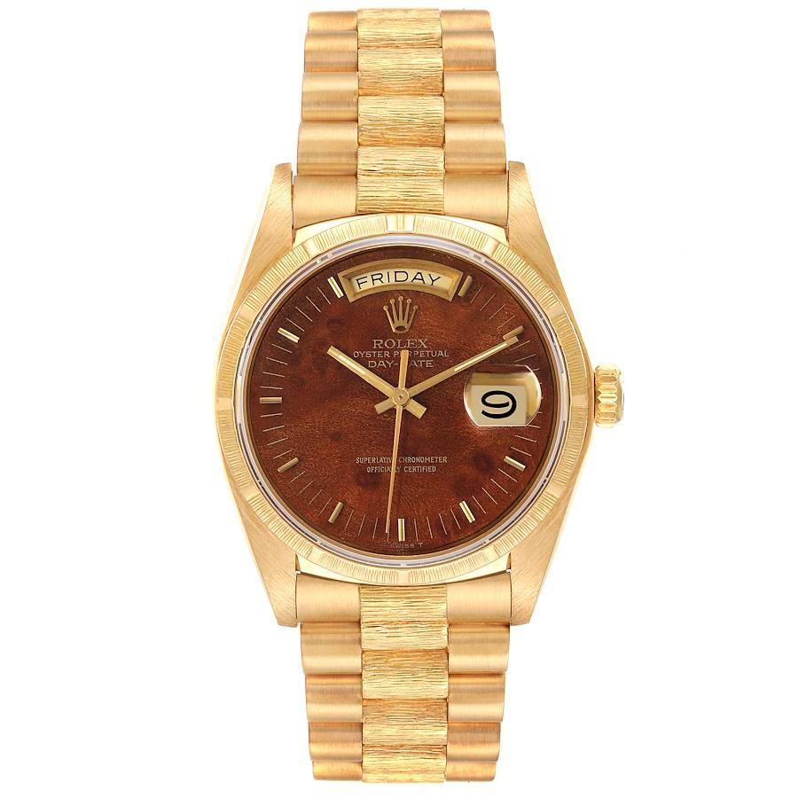 Rolex President Day-Date Yellow Gold Burl Wood Dial Mens Watch 18038. Officially certified chronometer self-winding movement. 18k yellow gold oyster case 36.0 mm in diameter.  Rolex logo on a crown. 18k yellow gold bark finish bezel. Scratch