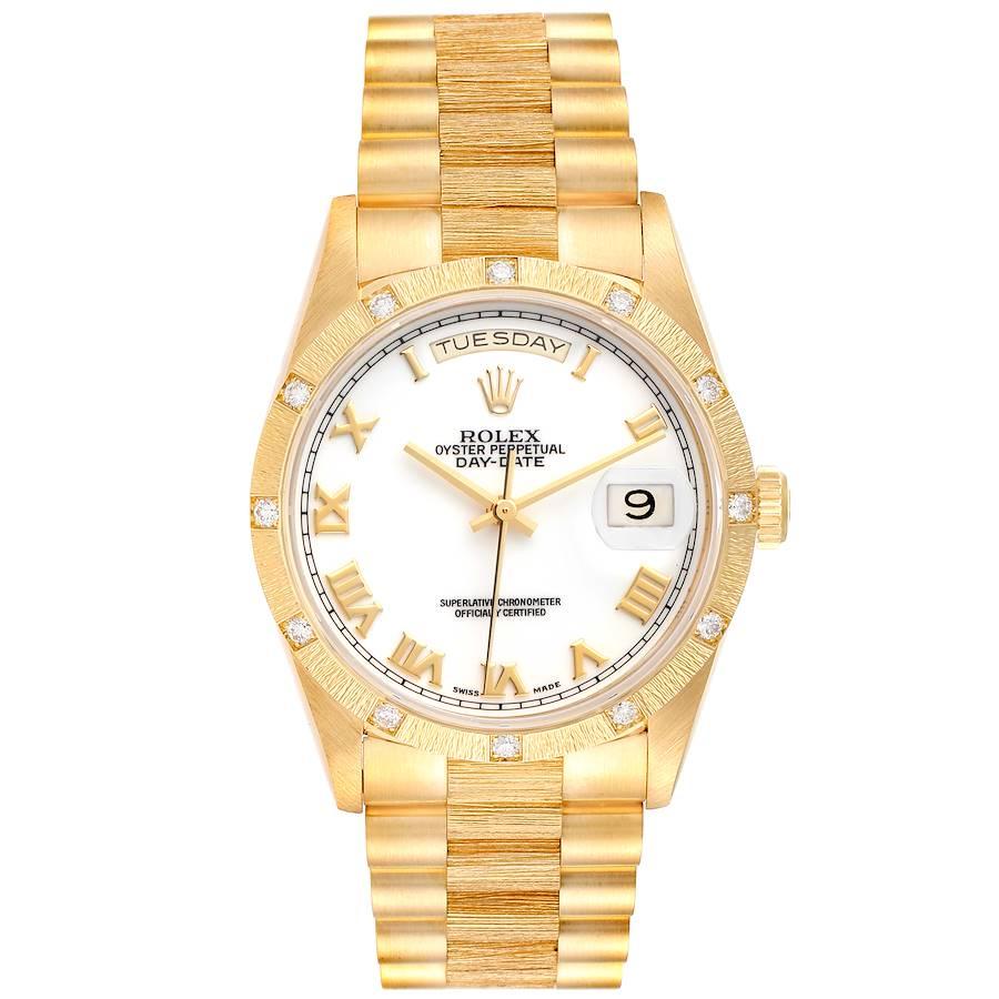 Rolex President Day-Date Yellow Gold Diamond Mens Watch 18308. Officially certified chronometer self-winding movement. 18k yellow gold oyster case 36.0 mm in diameter. Rolex logo on a crown. 18k yellow gold bark finish with Rolex factory diamond