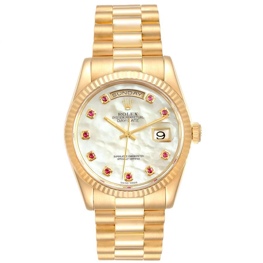 Rolex President Day Date Yellow Gold MOP Rubies Mens Watch 118238 Box Papers. Officially certified chronometer self-winding movement. 18k yellow gold oyster case 36.0 mm in diameter. Rolex logo on a crown. 18K yellow gold fluted bezel. Scratch