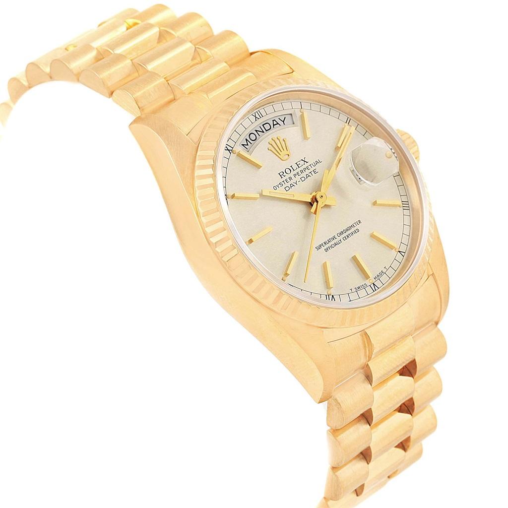 Rolex President Day-Date Yellow Gold Silver Dial Mens Watch 18038. Officially certified chronometer automatic self-winding movement. 18k yellow gold oyster case 36.0 mm in diameter. Rolex logo on a crown. 18k yellow gold fluted bezel. Scratch