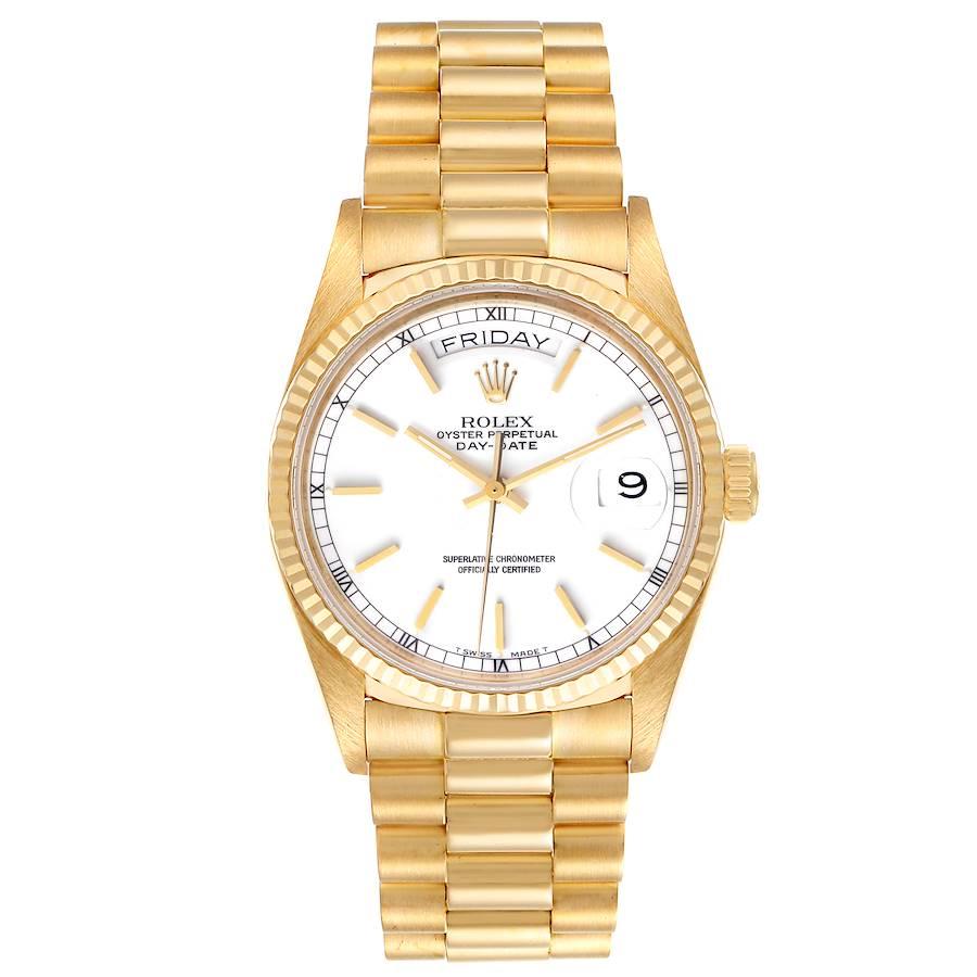 Rolex President Day-Date Yellow Gold White Dial Mens Watch 18038. Officially certified chronometer self-winding movement. 18k yellow gold oyster case 36.0 mm in diameter. Rolex logo on a crown. 18k yellow gold fluted bezel. Scratch resistant