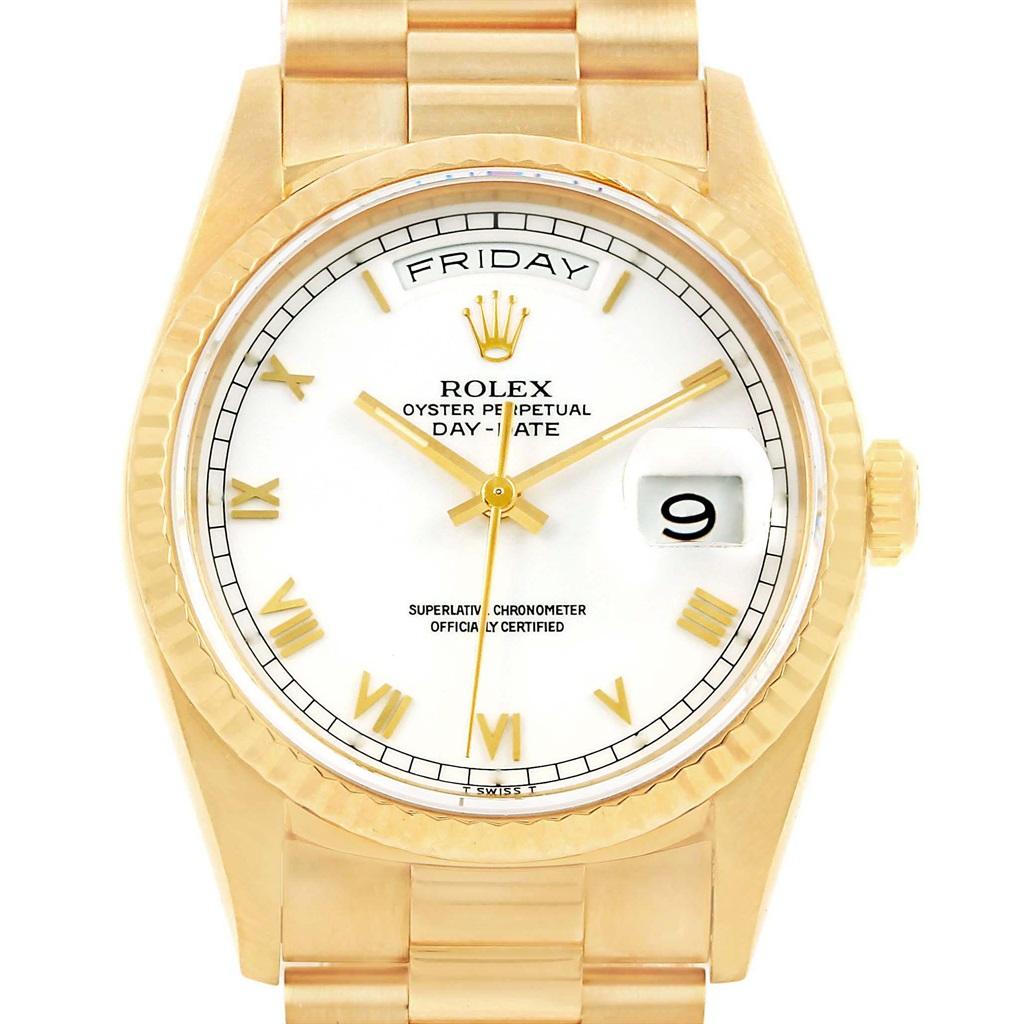 Rolex President Day-Date Yellow Gold White Dial Mens Watch 18238. Officially certified chronometer automatic self-winding movement. 18k yellow gold oyster case 36.0 mm in diameter. Rolex logo on a crown. 18k yellow gold fluted bezel. Scratch
