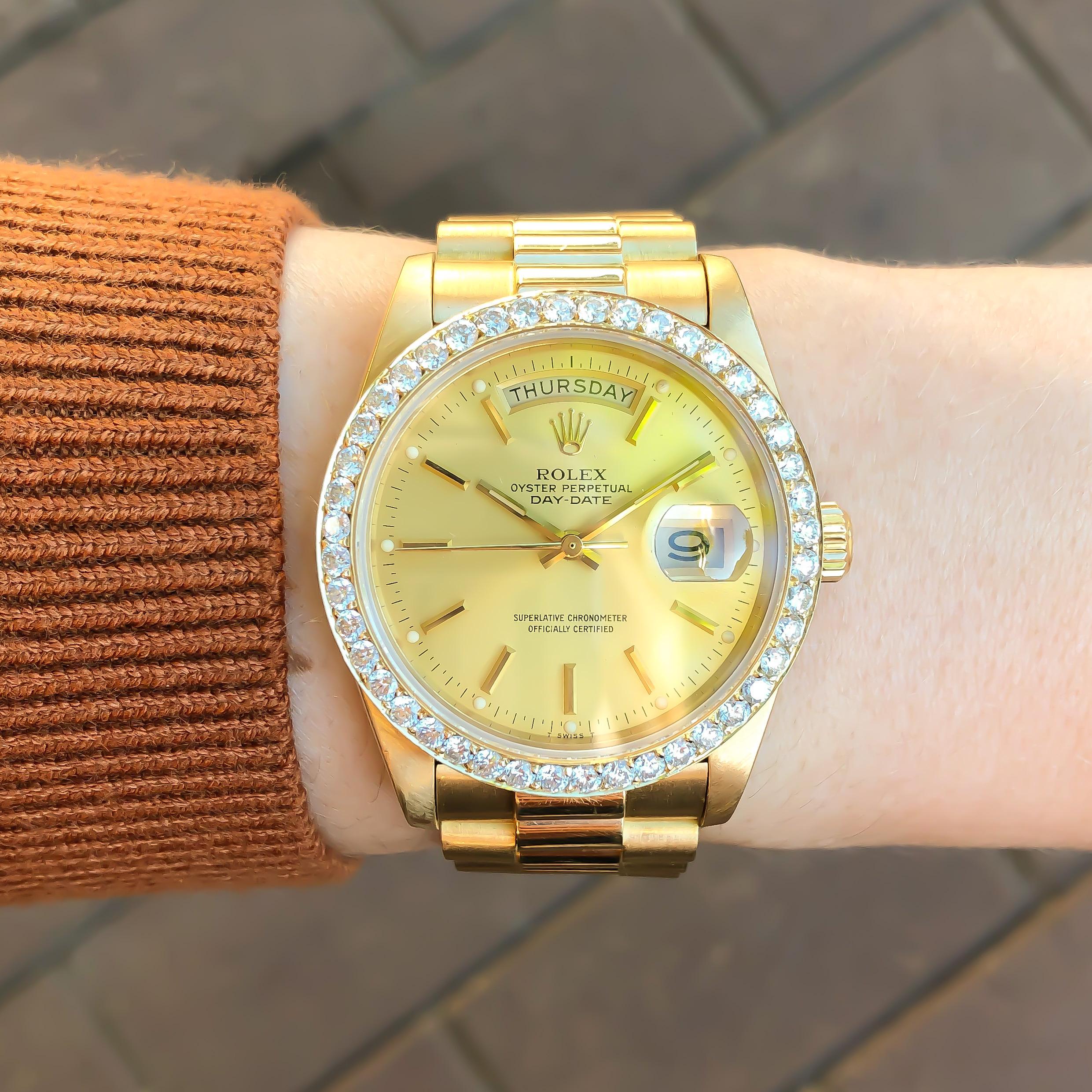 Rolex President Daydate Diamond Bezel 18K Yellow Gold #18038 1983 2.20CTW

•MODEL NO: 18038
•SERIAL NO: 743****
•MOVEMENT: AUTOMATIC SELF WINDING
•CASE MATERIAL: 18 KARAT YELLOW GOLD
•CONDITION: EXCELLENT PRE-OWNED
•CASE MEASUREMENTS: 36MM X 44MM X