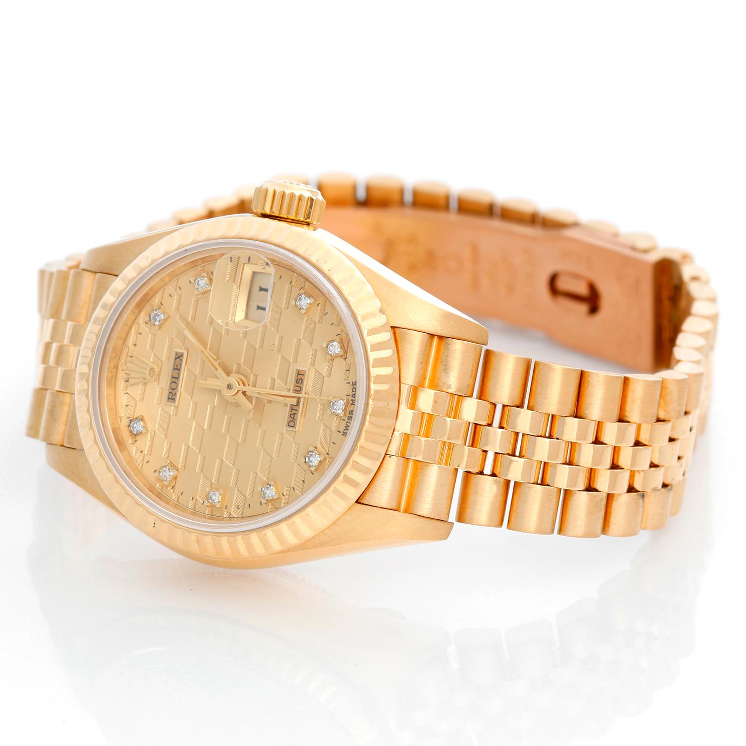 Rolex President Ladies 18k Yellow Gold Watch 69178 - Automatic winding, 29 jewels, Quickset date, sapphire crystal. 18k yellow gold case with fluted bezel (26mm diameter). Champagne Chevy Diamond dial . 18k yellow gold hidden-clasp President