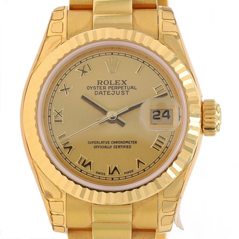 Brand: Rolex
Model: President Lady-Datejust
Model Number: 179178
Movement: Automatic
Warranty: One Year
Year: 2003 - 2005
Movement Maker: Swiss
Dial Color: Gold Roman

Metal Content: 18k Yellow Gold

Fastening Type: Fold-Over Clasp
Features: 
Fluted
