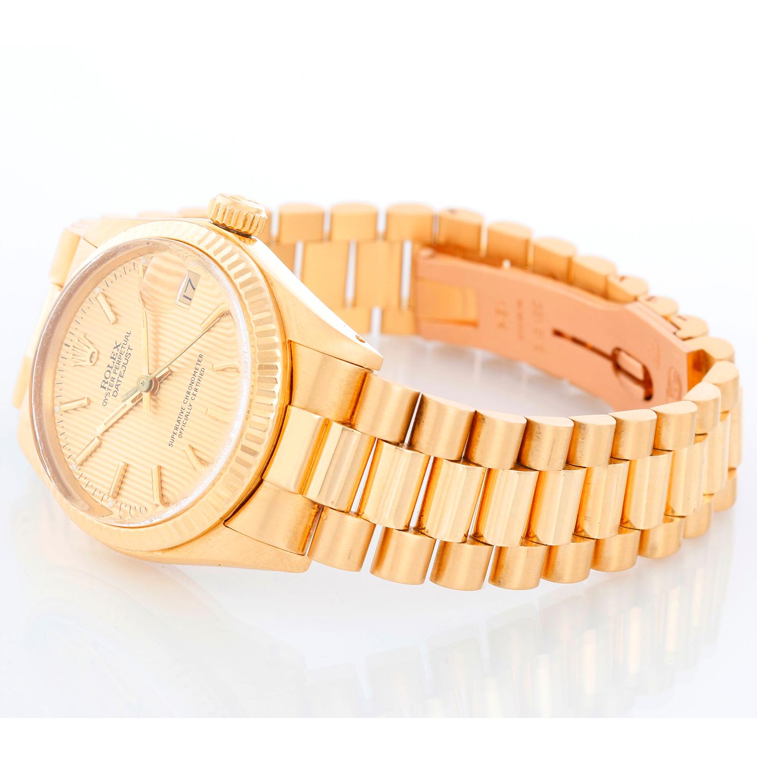 Rolex President Midsize 18K Yellow Gold Watch 6827 - Automatic winding. 18K Yellow gold l (31mm diameter). Champagne Tapestry dial with gold stick markers. 18K Yellow gold President bracelet. Pre-owned with box. 