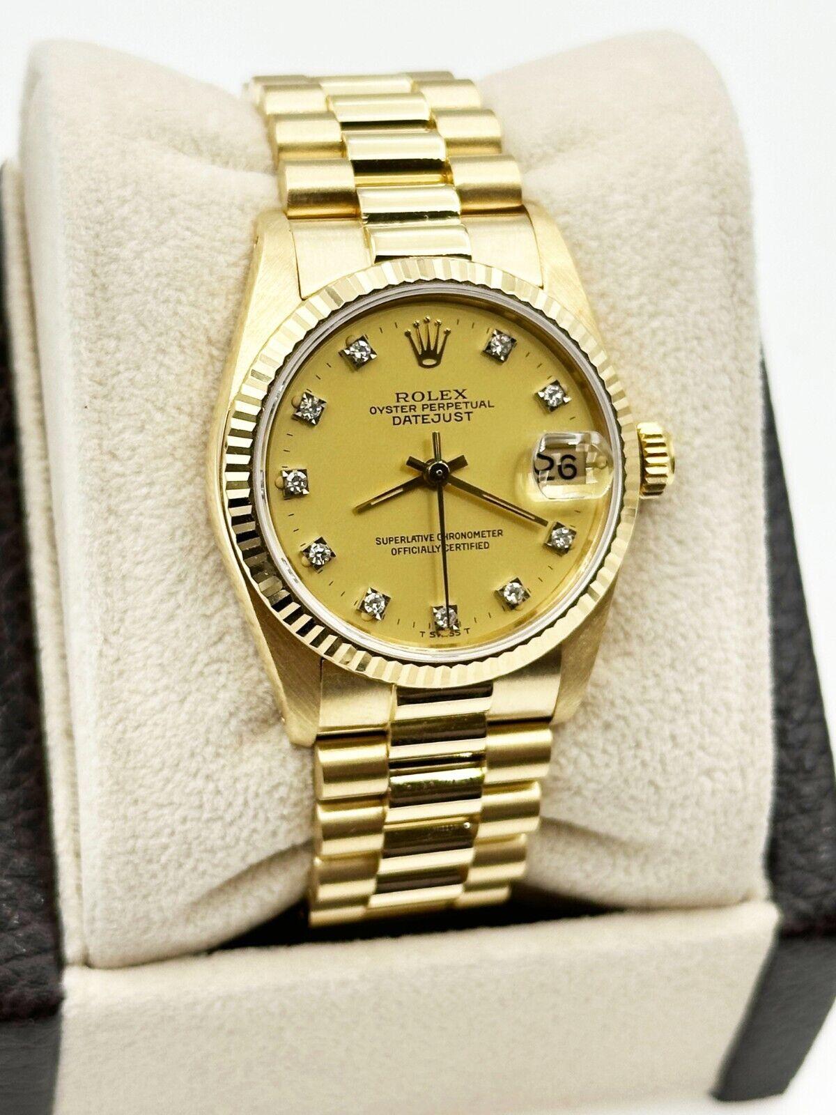 Style Number: 6827

Serial: 8093***

Year: 1984

Model: Midsize President

Case Material: 18K Yellow Gold 

Band: 18K Yellow Gold 

Bezel: 18K Yellow Gold 

Dial: Factory Champagne Diamond Dial

Face: Sapphire Crystal

Case Size: 31mm
 
Includes: