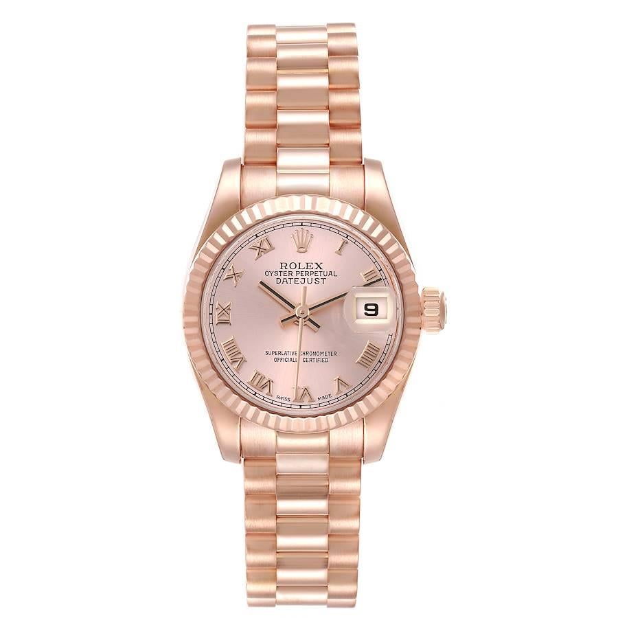 Rolex President Rose Gold Rose Roman Dial Ladies Watch 179175 Box Card. Officially certified chronometer self-winding movement. 18k Everose gold oyster case 26.0 mm in diameter. Rolex logo on a crown. 18k Everose gold fluted bezel. Scratch resistant
