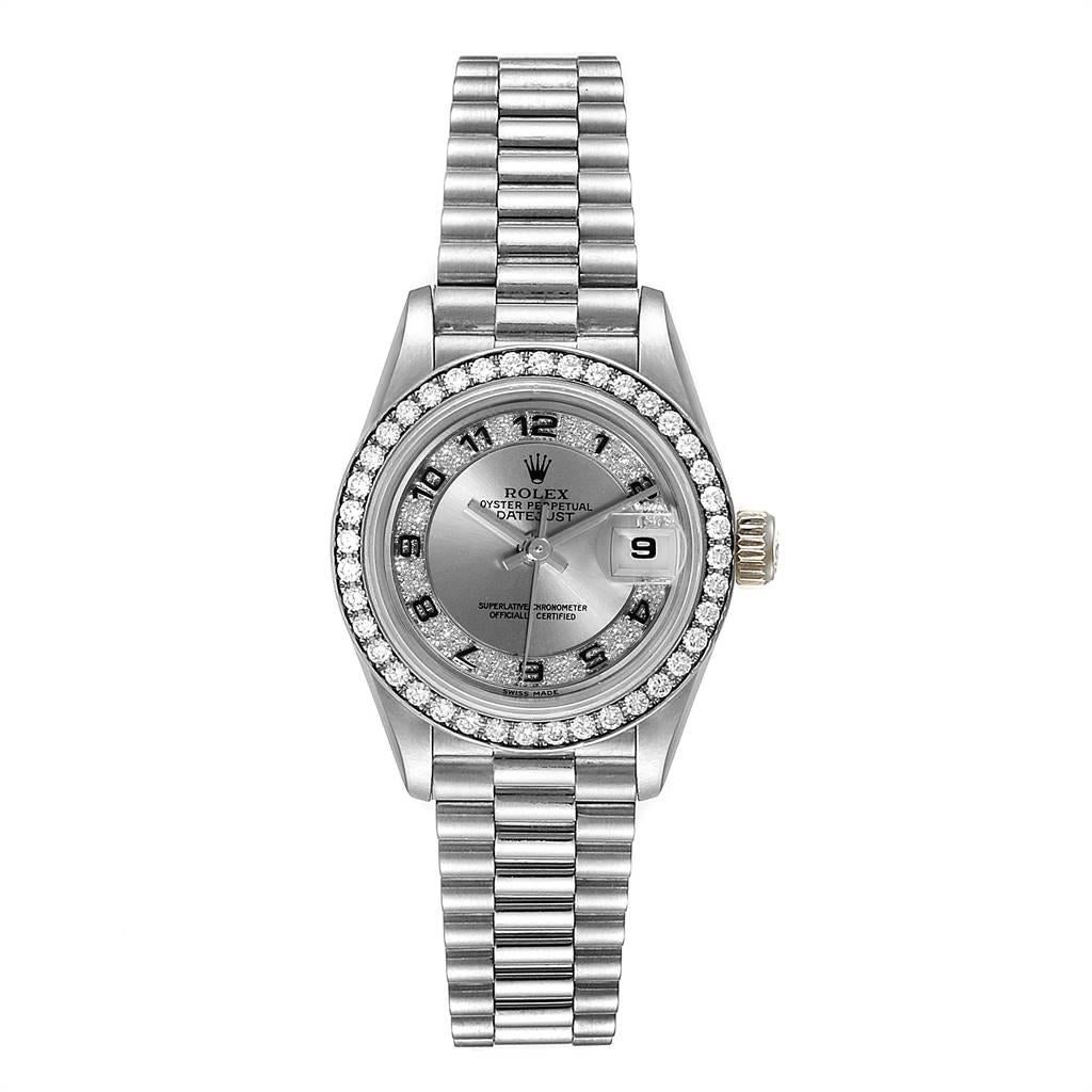 Rolex President White Gold Myriad Diamond Dial Ladies Watch 69179. Officially certified chronometer self-winding movement. 18k white gold oyster case 26.0 mm in diameter. Rolex logo on a crown. Original Rolex factory diamond bezel. Scratch resistant
