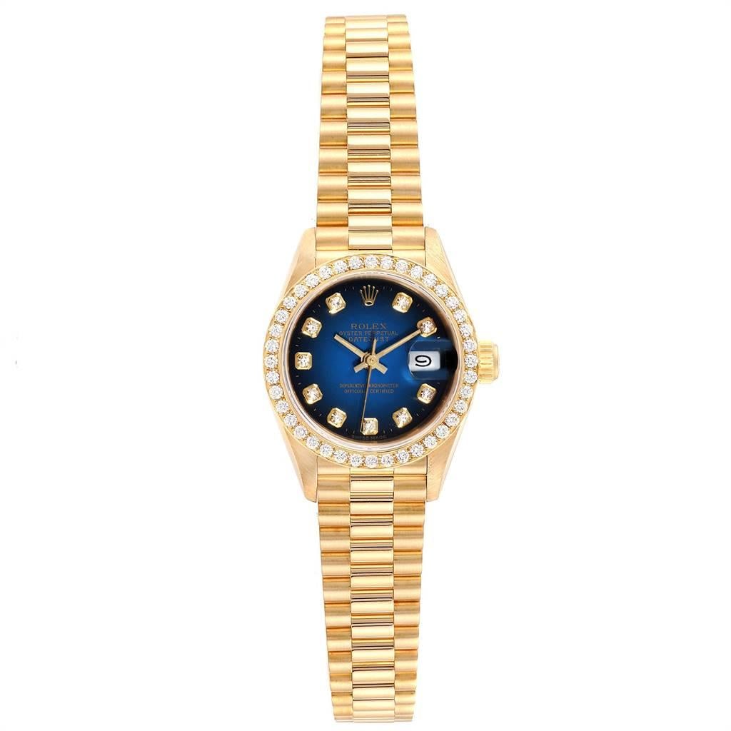 Rolex President Yellow Gold Blue Vignette Diamond Ladies Watch 69138. Officially certified chronometer self-winding movement. 18k yellow gold oyster case 26.0 mm in diameter. Rolex logo on a crown. Original Rolex 18k yellow gold diamond bezel.