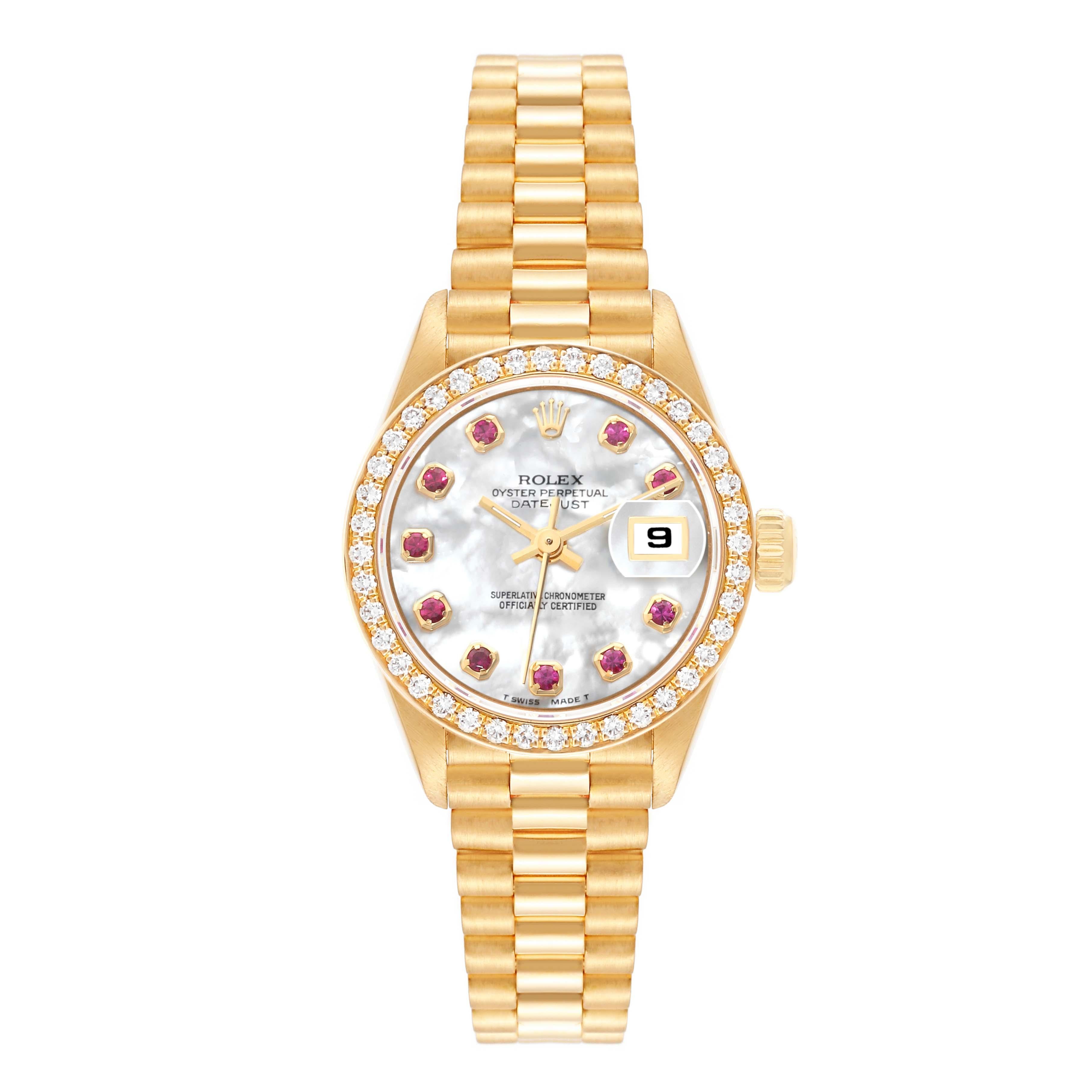 Rolex President Yellow Gold Mother Of Pearl Ruby Dial Diamond Ladies Watch 69138 Box Papers. Officially certified chronometer automatic self-winding movement. 18k yellow gold oyster case 26.0 mm in diameter. Rolex logo on the crown. 18k yellow gold