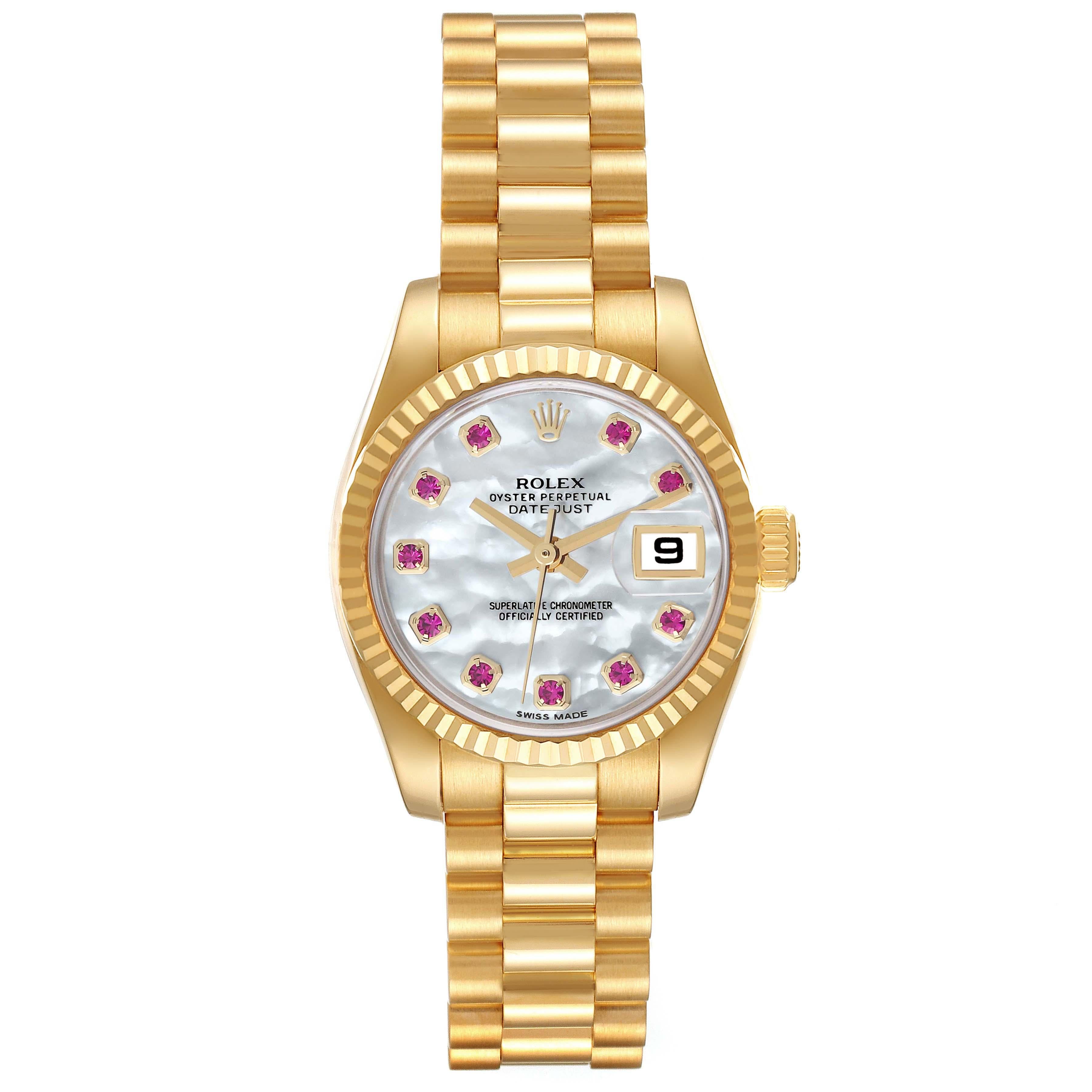 Rolex President Yellow Gold Mother Of Pearl Ruby Diamond Ladies Watch 179178. Officially certified chronometer self-winding movement. 18k yellow gold oyster case 26.0 mm in diameter. Rolex logo on a crown. 18k yellow gold fluted bezel. Scratch