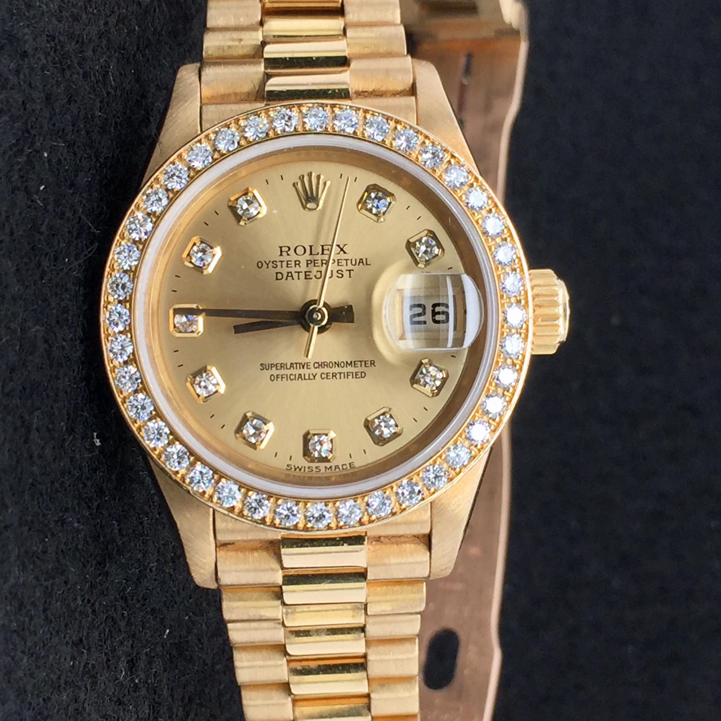 Rolex Presidential Yellow Gold Ladies Watch in 18 kt. with a gold oyster case.  26mm diameter. Champagne dial . 