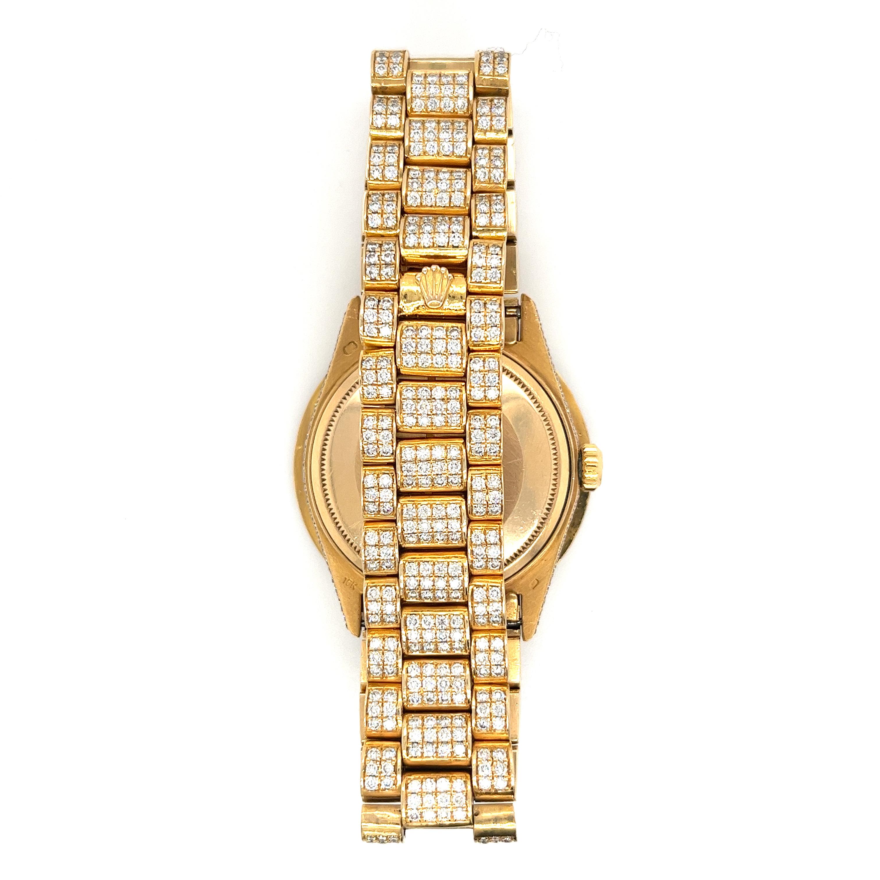 Rolex DayDate With Mother Of Pearl dial and 18k gold Rolex Presidential bracelet. The watch bears 20 carats in natural diamonds, featuring an iced-out diamond bezel, roman numeral hour markers, and a diamond bracelet. The mother of pearl dial is a