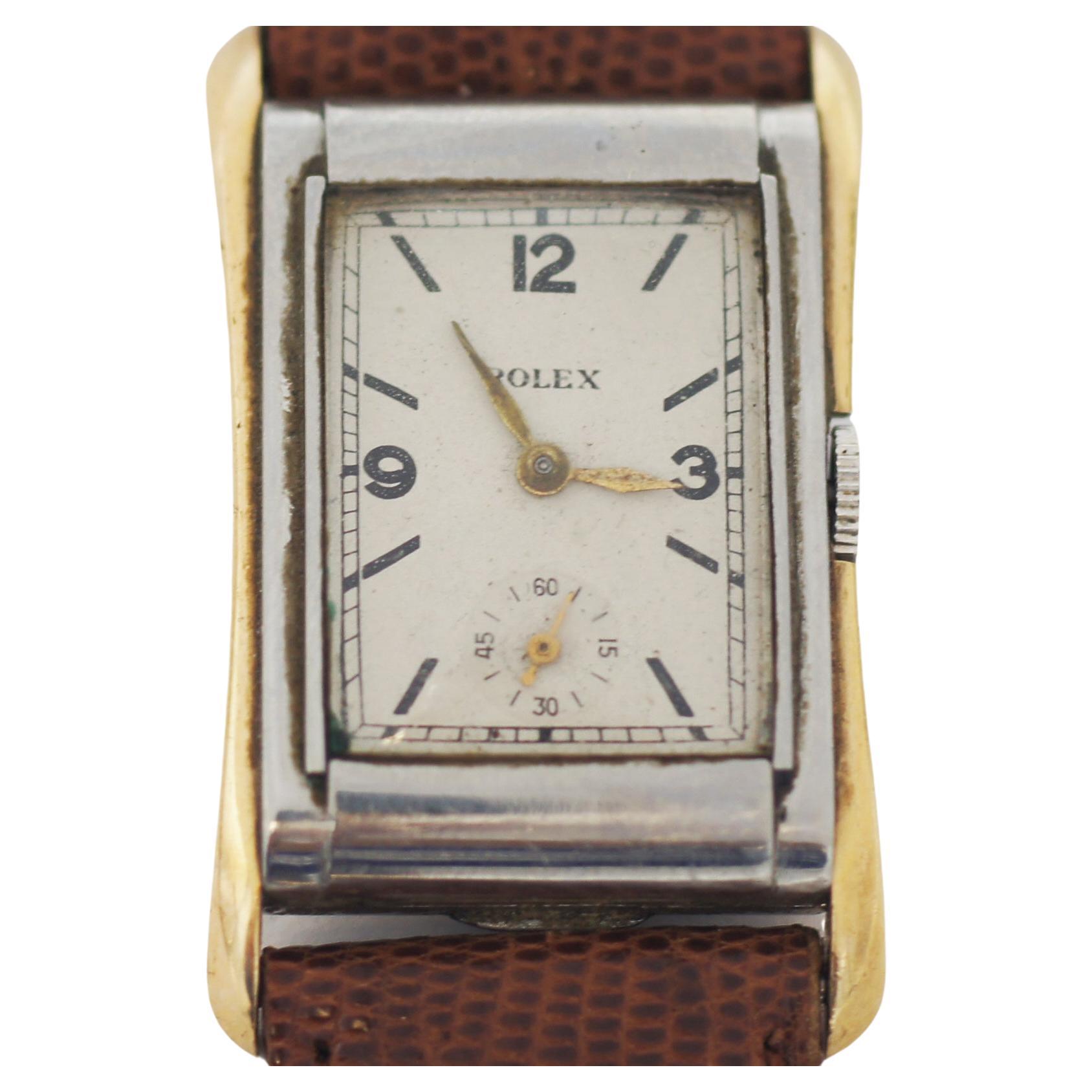 Rolex
Vintage
Cellini prince
Circa approximately 1930s
Steel & Gold case
Dial off white with black numeral and markers
Golden Hands
Second Sub-dial
Case Approx. 28mm x 40mm
Mechanical hand-wind movement
15 Rubies
Leather band
Rolex buckle
watch