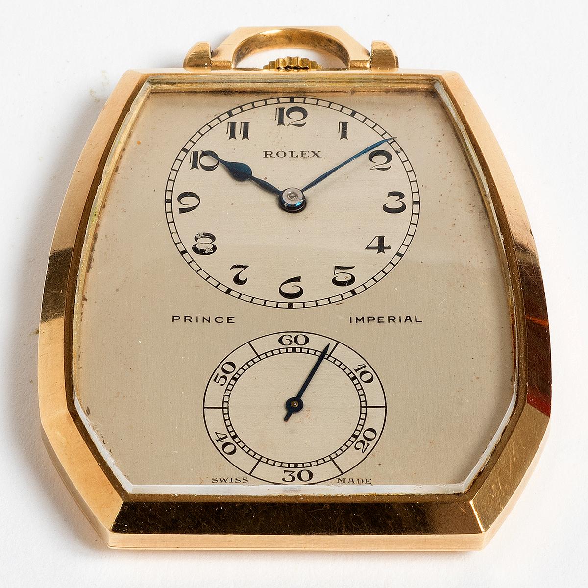 Our very rare and attractive Rolex Prince Imperial pocket watch features a 9k yellow gold case of c.45mm x 40mm. Of note is the original dial, with arabic numerals of a deco style to the hour and minute, with sub dial seconds. This is a highly