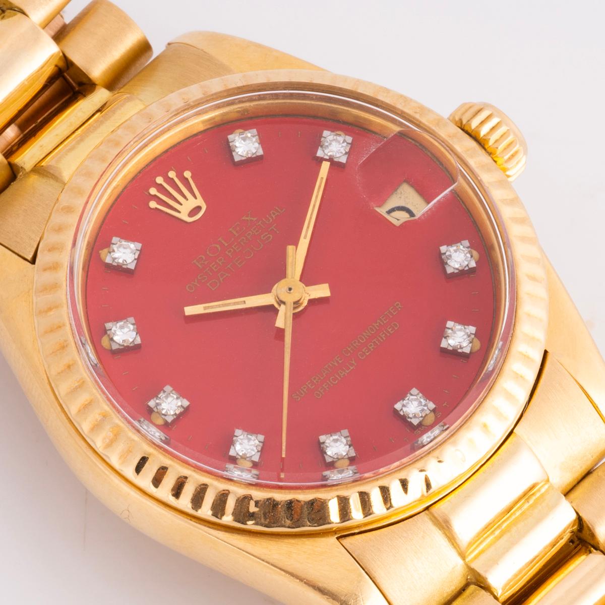 A rare vintage yellow gold mid-size 31mm Datejust by Rolex. Features a coral stella diamond-set dial and a fixed yellow gold fluted bezel. Fitted with sapphire glass and a self-winding automatic movement. The president bracelet comes equipped with a