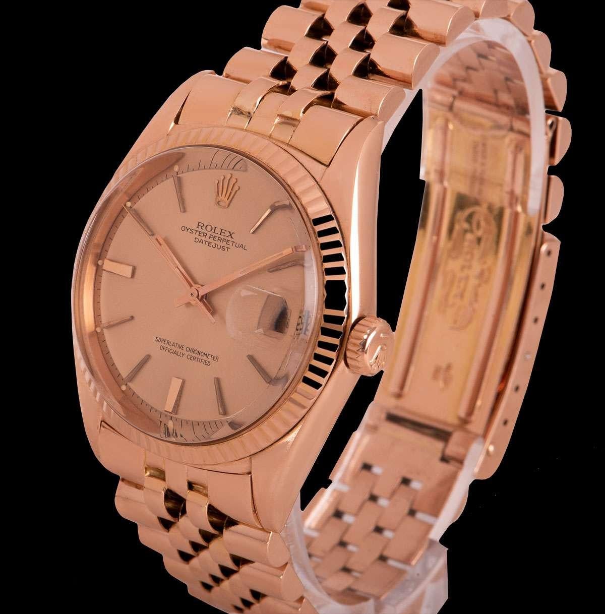 A Rare 36 mm 18k Red Gold Oyster Perpetual Datejust Vintage Gents Wristwatch, champagne dial with applied hour markers, date at 3 0'clock, a fixed 18k red gold fluted bezel, an 18k red gold jubilee bracelet with an 18k red gold deployant clasp,