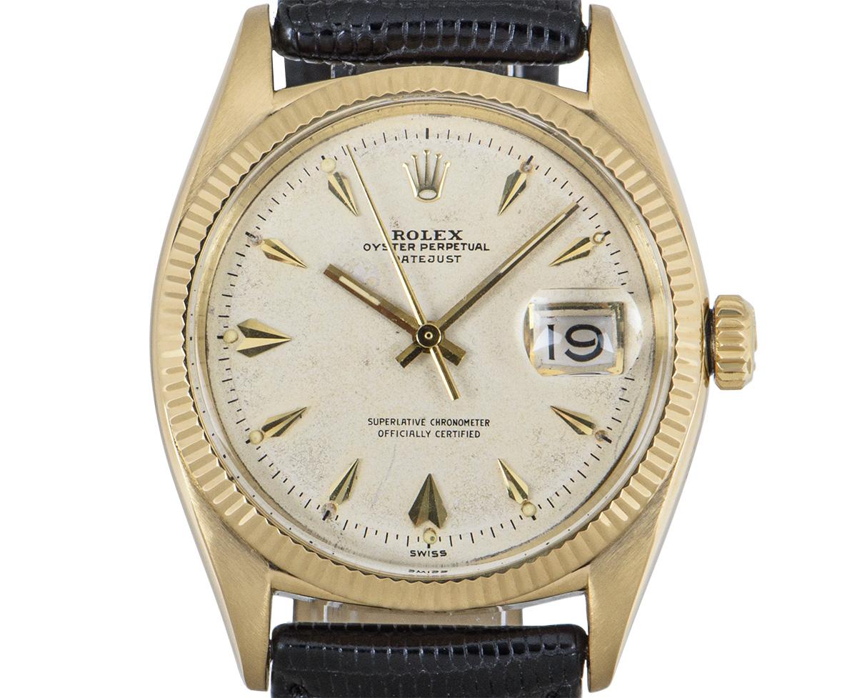 This 36 mm rare vintage Datejust by Rolex is in wonderful condition. In yellow gold, with a silver dagger dial that features a black and red roulette date wheel with an open 6 and 9. The fluted bezel is a Rolex signature. Fitted with a generic black