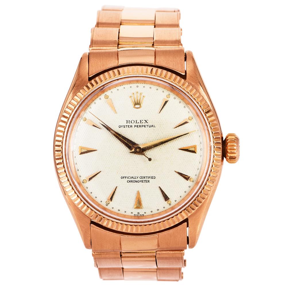 Rare Pre-Owned Vintage Rolex Oyster Perpetual, Circa 1950s Reference number 6285, 18K Rose Gold,  34mm Case With Honeycomb White Dial and 18K Rose Gold Oyster Bracelet with Automatic Winding, 34mm, Plexiglass Crystal.

 In Very Good Condition.

